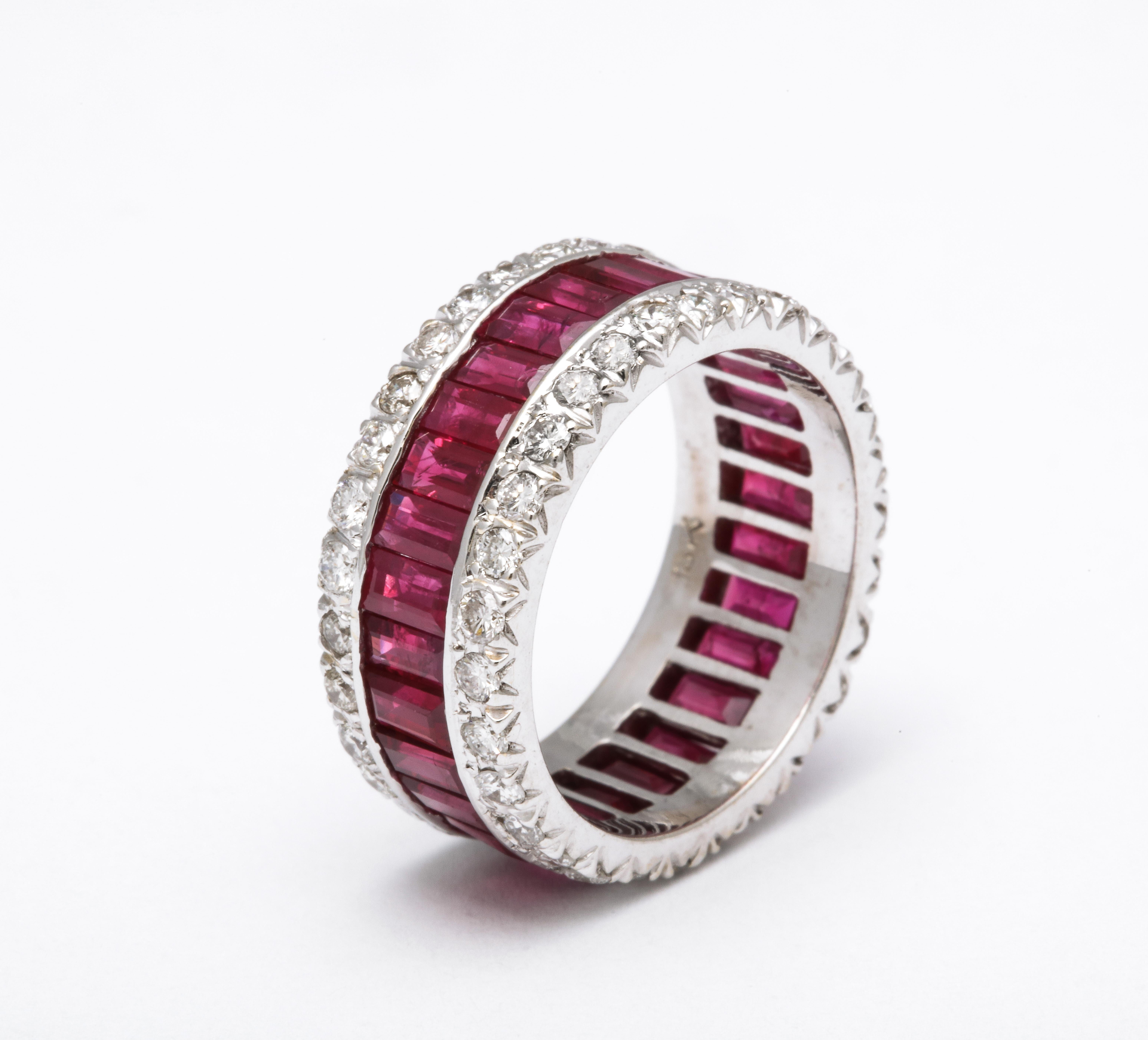 A beautiful wide band with the perfect pop of color. 

5.50 carats of fine Ruby baguettes

1.50 carats of white round brilliant cut diamonds 

18k white gold 

8.5 mm wide 

Size 6