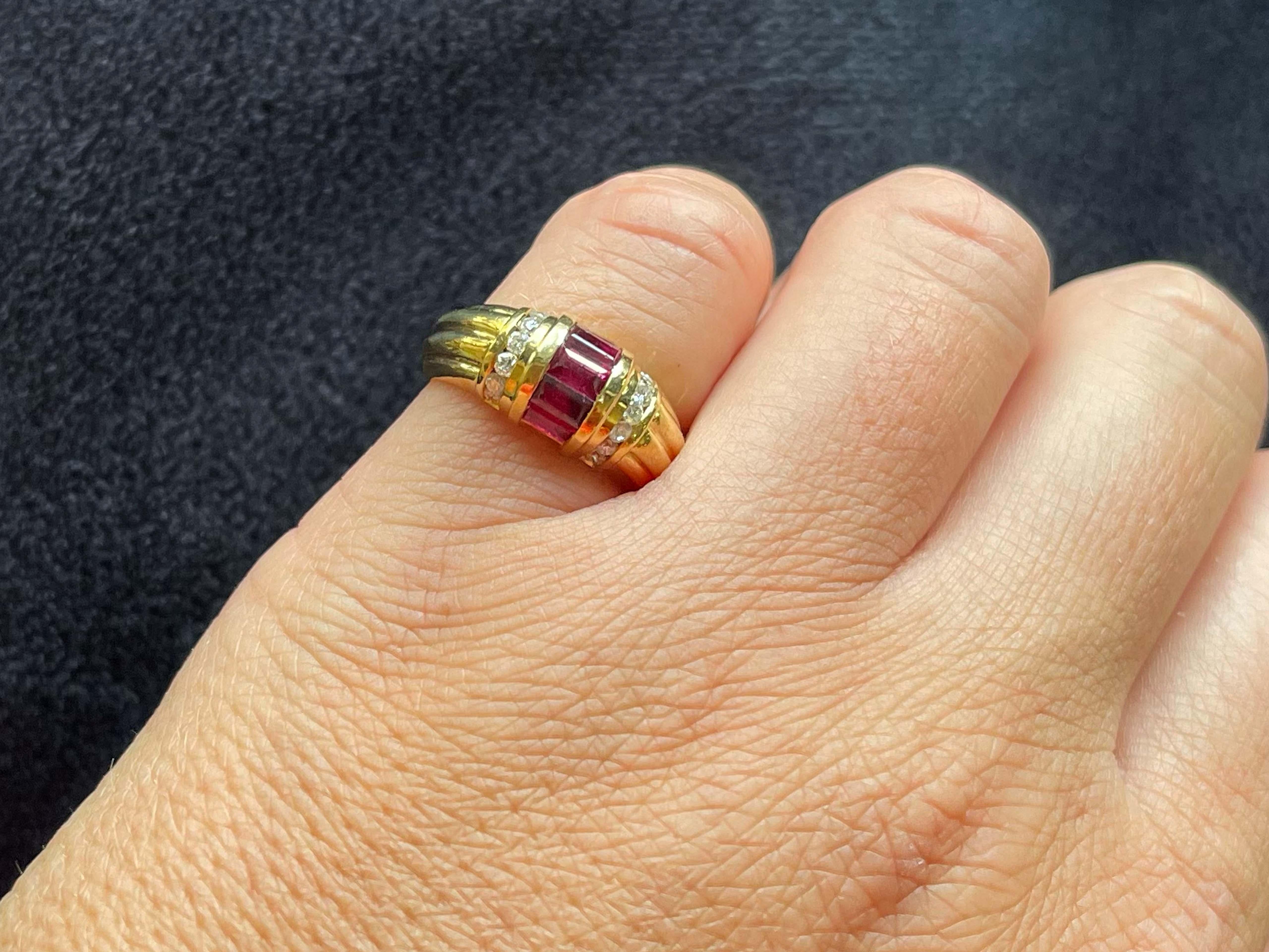 Item Specifications:

Metal: 18K Yellow Gold

Style: Statement Ring

Ring Size: 5.5 (resizing available for a fee)

Total Weight: 6.2 Grams

Gemstone Specifications:

Gemstones: 5 red rubies

Ruby Carat Weight: 1.34 carats

Diamond Carat Weight: