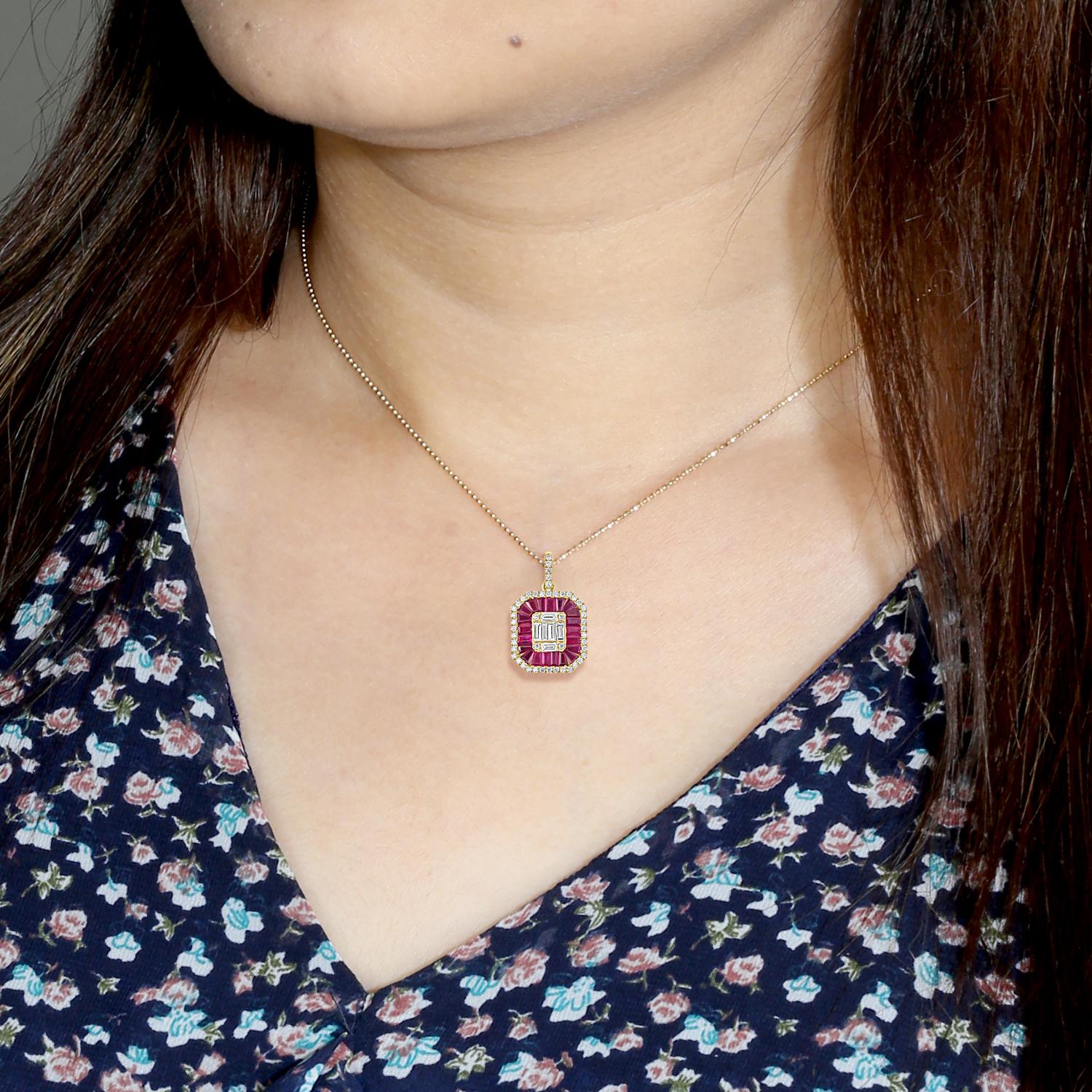 Designed with refined simplicity, this elegant pendant showcases a baguette-shaped Mozambique ruby, surrounded by a halo of pavé-set diamonds. The vivid 1.75-carat ruby sits at the center of this graceful silhouette, its linear form creating a