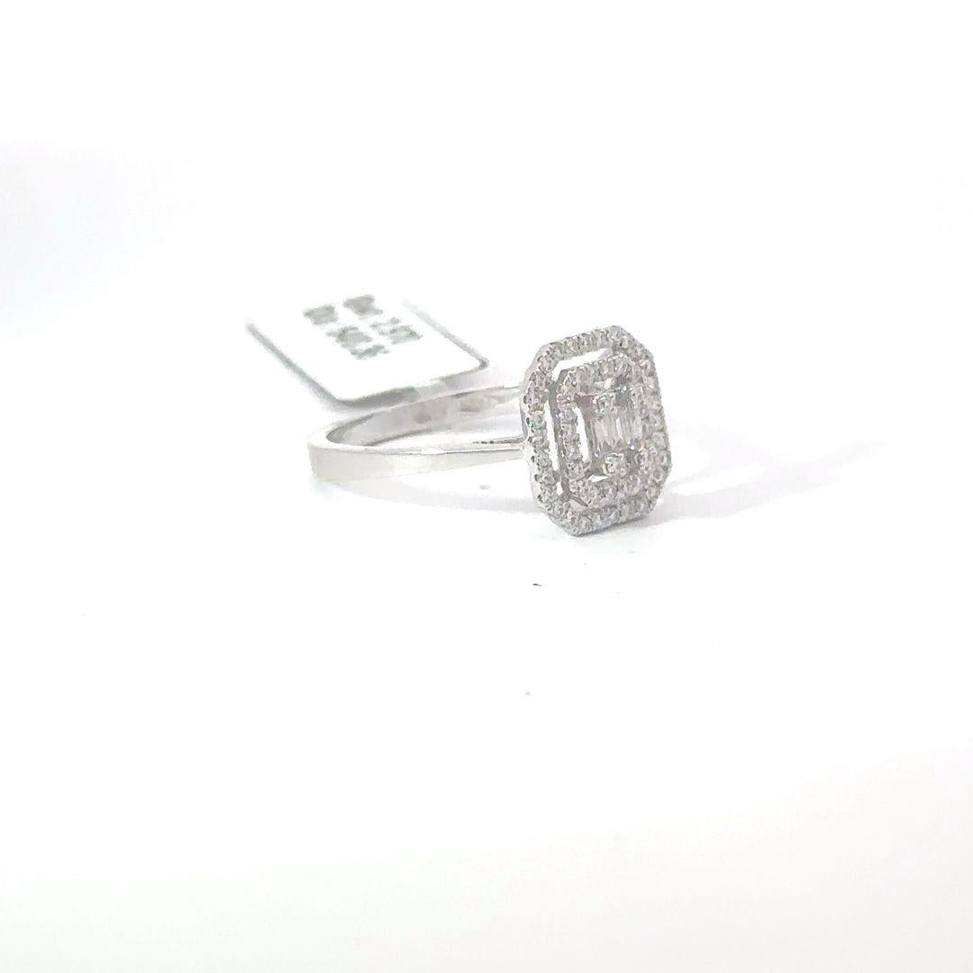 Indulge in the pinnacle of opulence with this extraordinary diamond ring, which features a captivating array of precision-cut diamonds that elegantly surround the central baguette stone, creating a radiant halo that captivates the viewer. This ring,