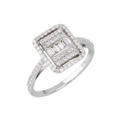 Anello con baguette e diamanti rotondi in oro bianco 18 carati