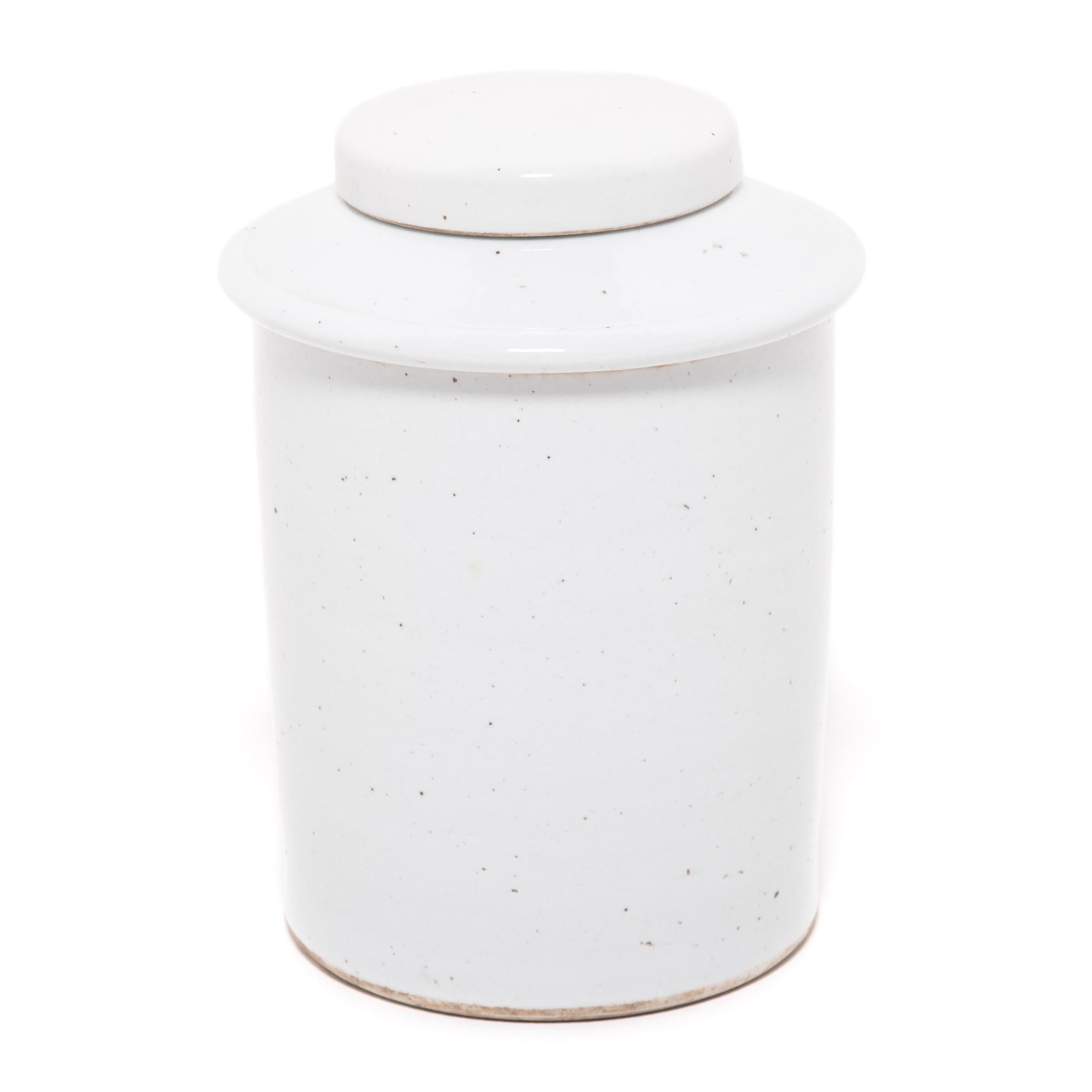 Rendered in a striking cool white glaze, this contemporary porcelain jar offers a modern take on a classic form. Lidded jars like these were used in tea shops in China, where tea drinking was a symbol of taste and upper-class refinement.

Additional