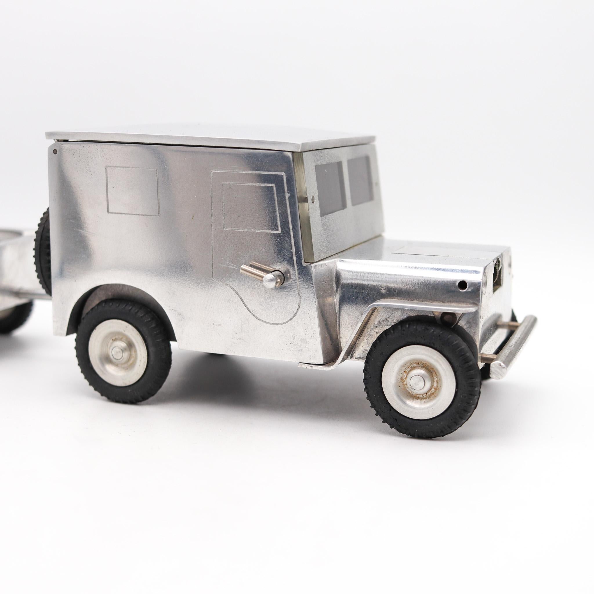 Army Truck Lighter, Cigarette case & ashtray by Walter Baier Company.

Beautiful large sized aluminum jeep lighter by Baier. These wonderful and novel pieces were made very soon after the end of the world war II in Germany This type of product was