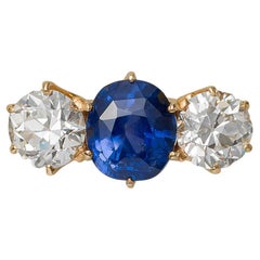 Bailey Banks and Biddle Three Stone Ring with Diamond and Sapphire