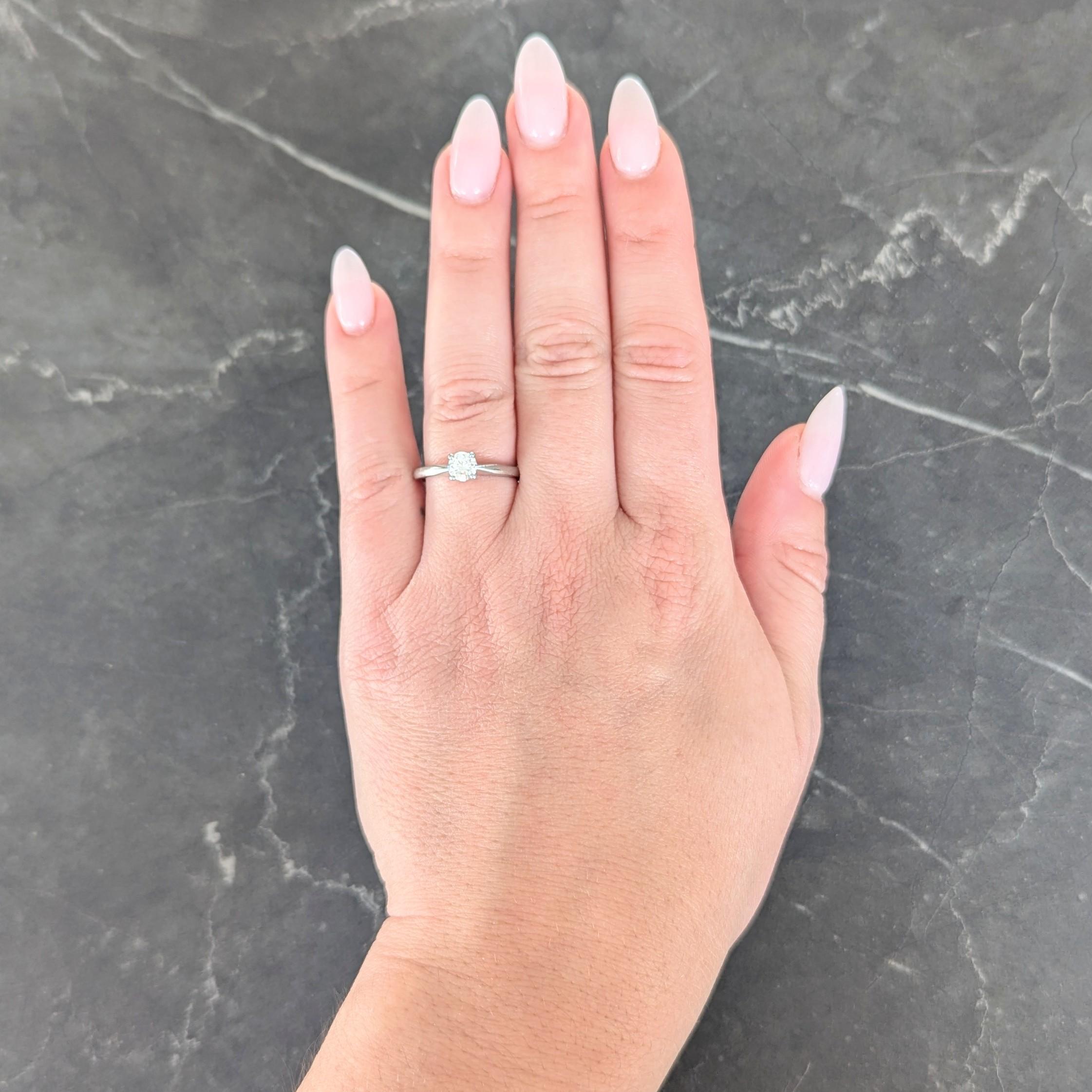 Centering a transitional cut diamond weighing approximately 0.45 carat total
H color with VS2 clarity - prong set in pierced basket
Flanked by tapered shoulders
Stamped for platinum
With maker's mark for Bailey Banks & Biddle
Circa: 1950s
Ring Size: