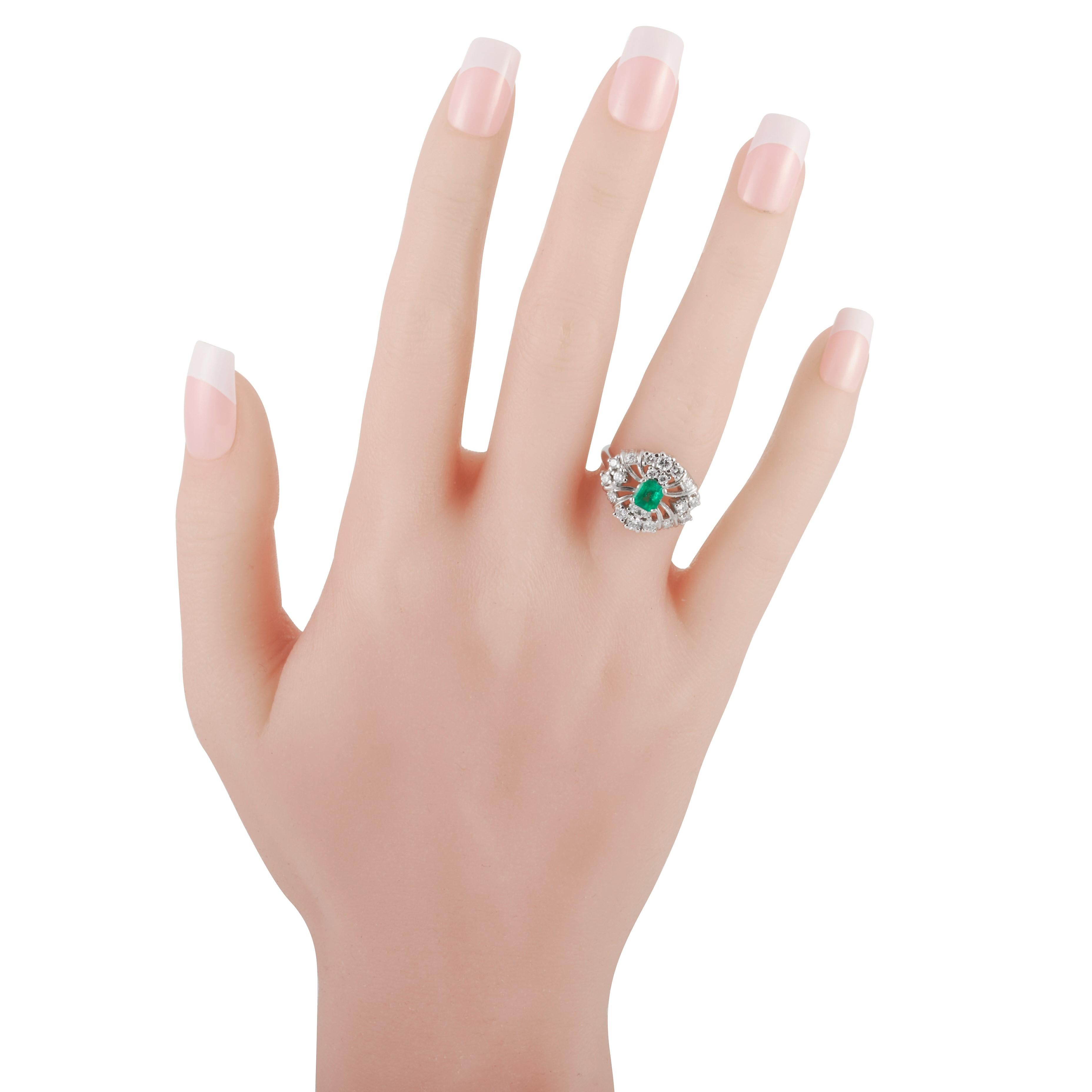 Bailey Banks & Biddle emerald and diamond ring in platinum.

The centerpiece of this ring is a 0.50 carat emerald cut emerald, it is surrounded by 20 round brilliant cut diamonds weighing approximately 1.05 carats with G-H color and VS clarity. 