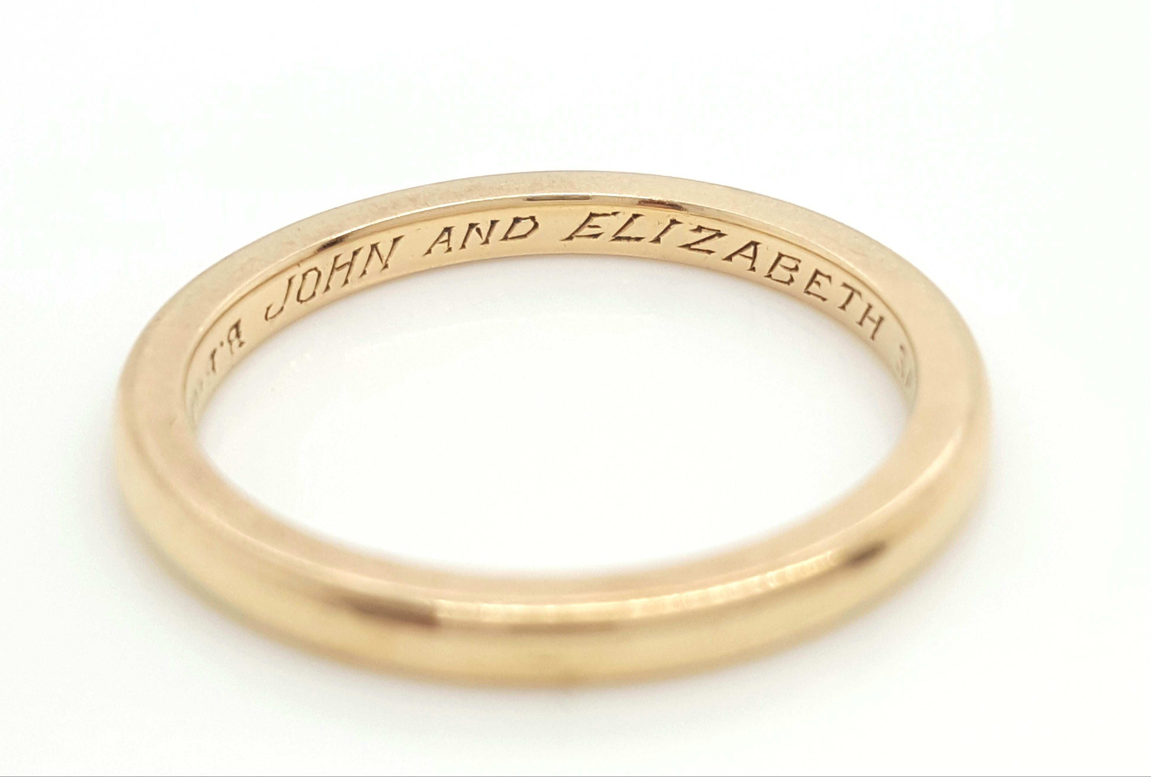 Bailey Banks & Biddle is a beautiful example of wedding band craftmanship in the 1920's. The antique 18K yellow gold smooth comfort fit band is perfect for anyone!  The engraving on the inside tells a sweet story of the past,  an eye catcher for the