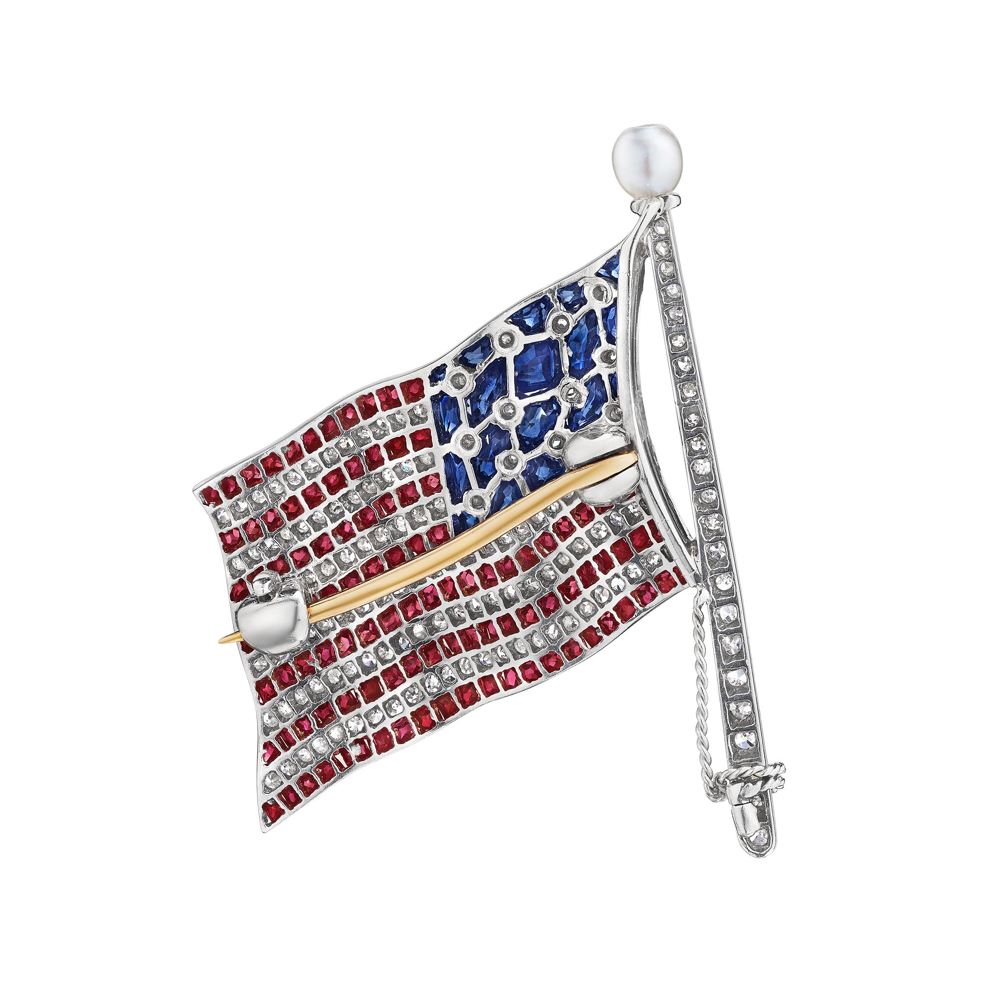 The Home of the Free and the Brave.  This Bailey, Banks and Biddle vintage diamond, ruby, sapphire, natural pearl, and platinum American Flag brooch will stand proudly on your lapel.  Circa 1930-40.  Signed BBB.  Total diamond weight approximately