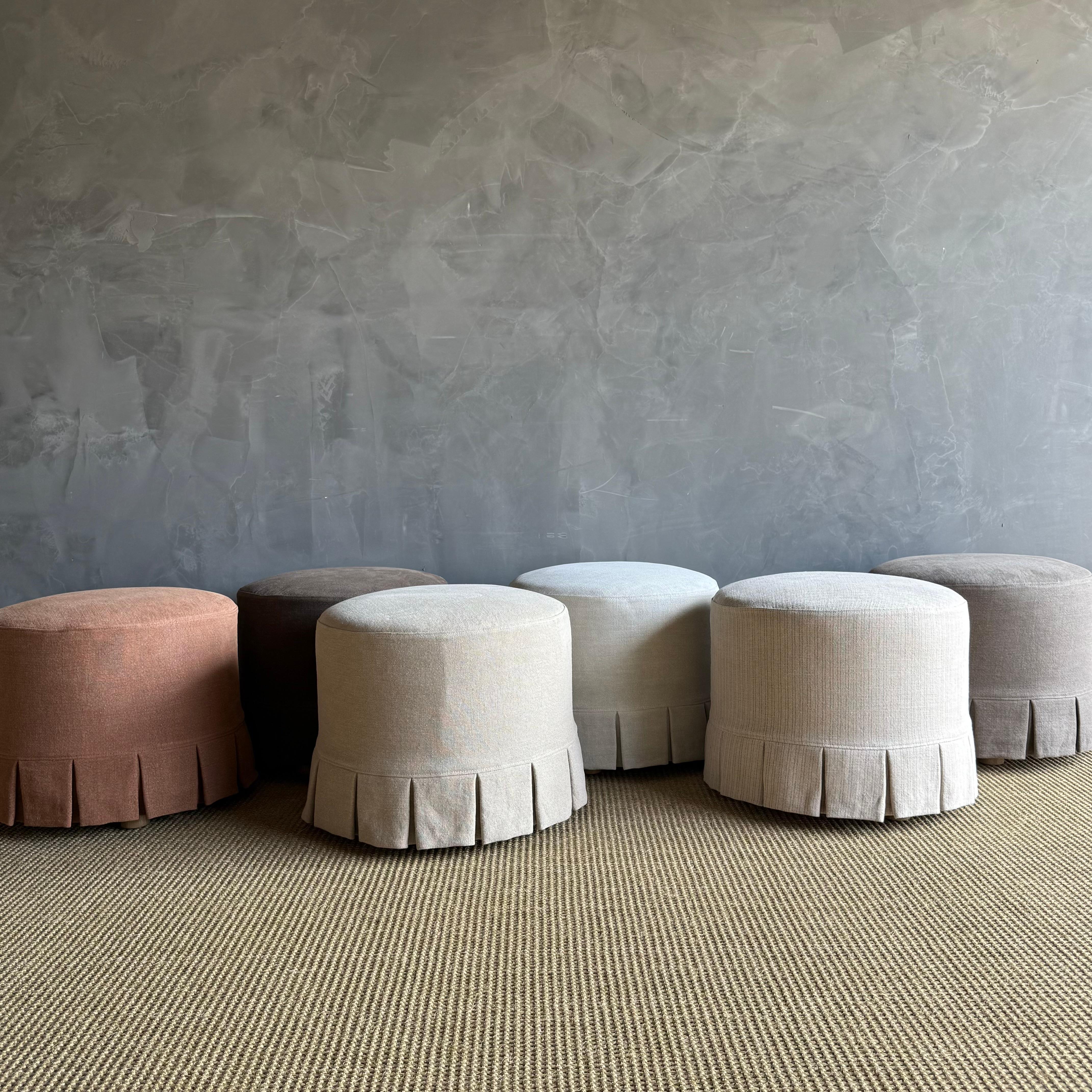 Introducing the Bailey Round Ottoman with Slip Cover

Our Bailey ottoman is upholstered in a sophisticated heavy weight hemp fabric with X pattern stitching, this ottoman is versatile and stylish. We have added a slip cover in the heavy stone washed