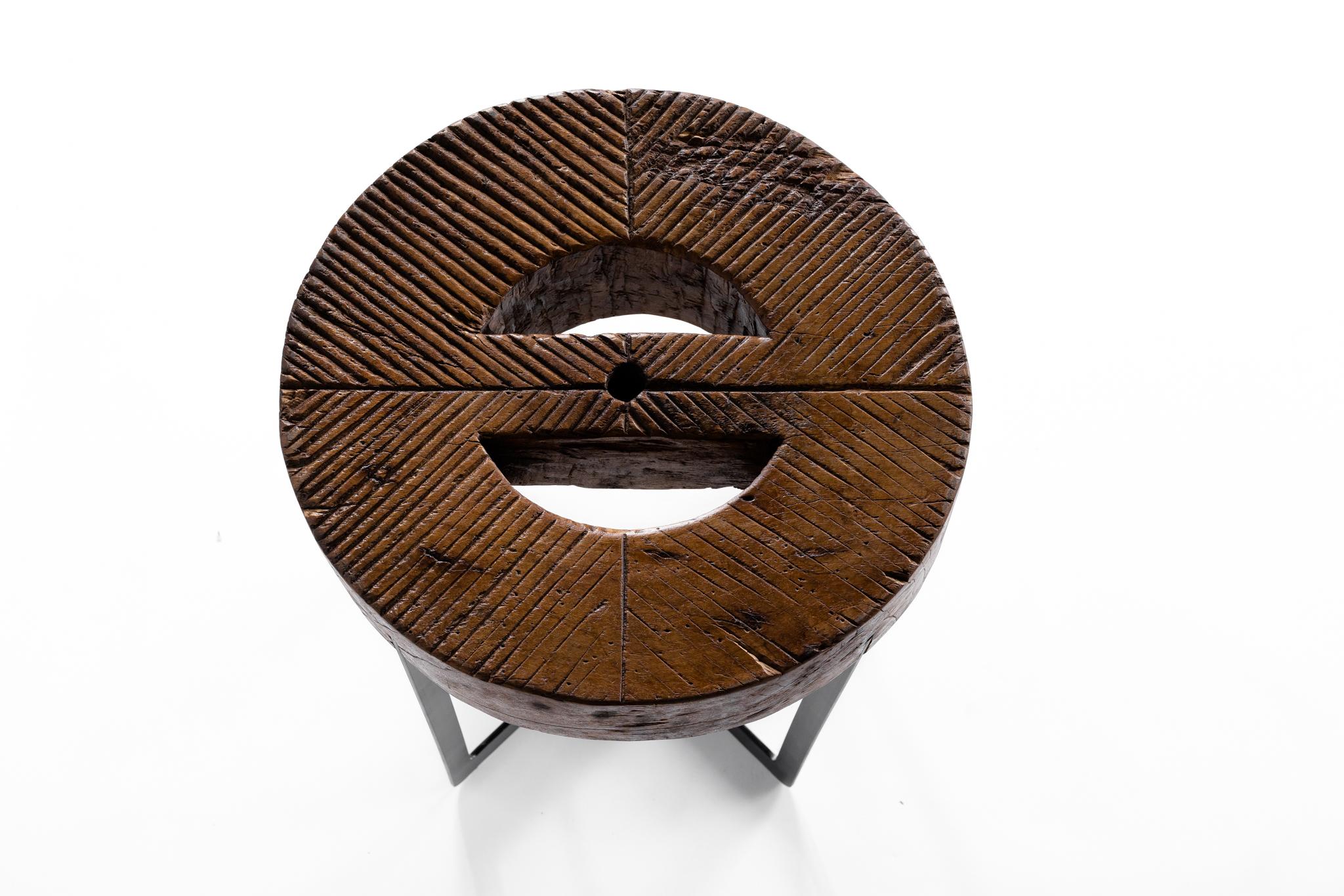 Balinese Wooden Mill Wheel on Ebony Patina Steel Base In Distressed Condition For Sale In Dallas, TX