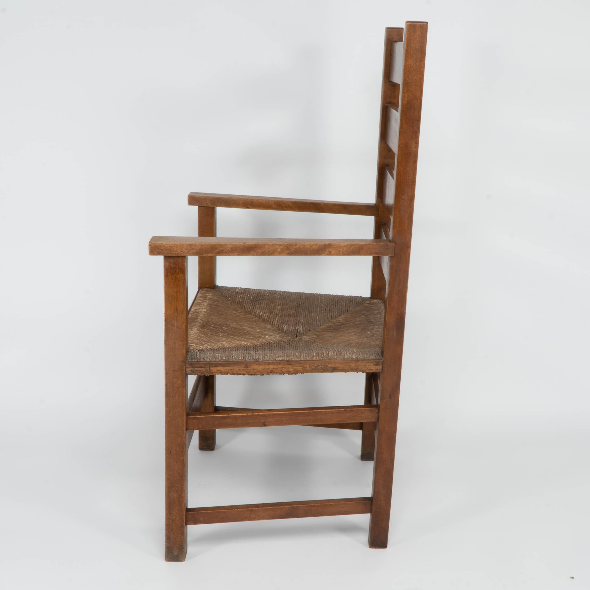 English Baillie Scott for J P White. Arts & Crafts oak & rush seat ladder back armchair. For Sale