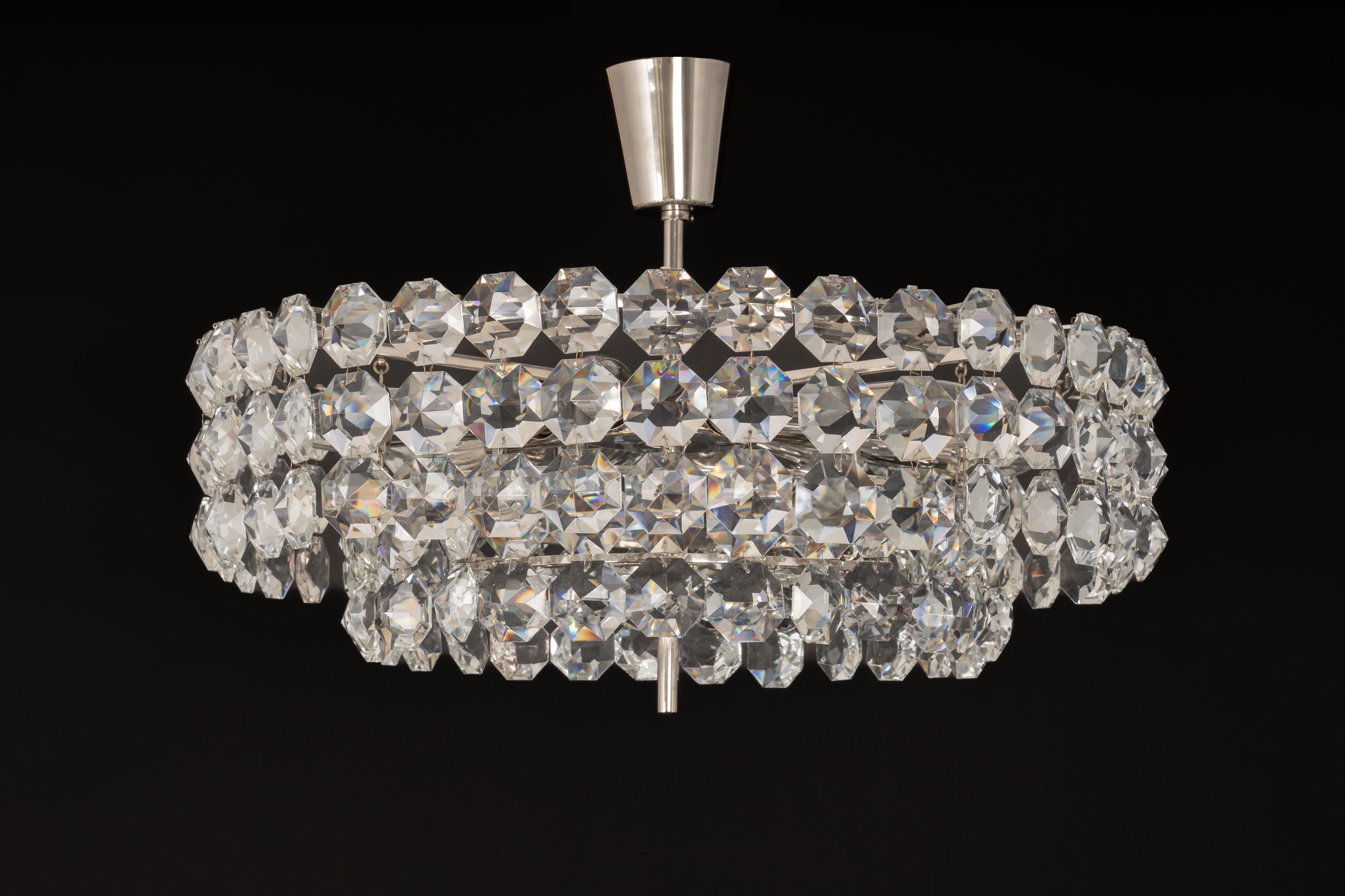 A stunning chandelier by Bakalowits & Sohne, Austria, manufactured in circa 1960-1969. A handmade and high-quality piece. The ceiling fixture and the frame are made of silver /Chrome with lots of facetted crystal glass elements. 

Sockets: 12 x