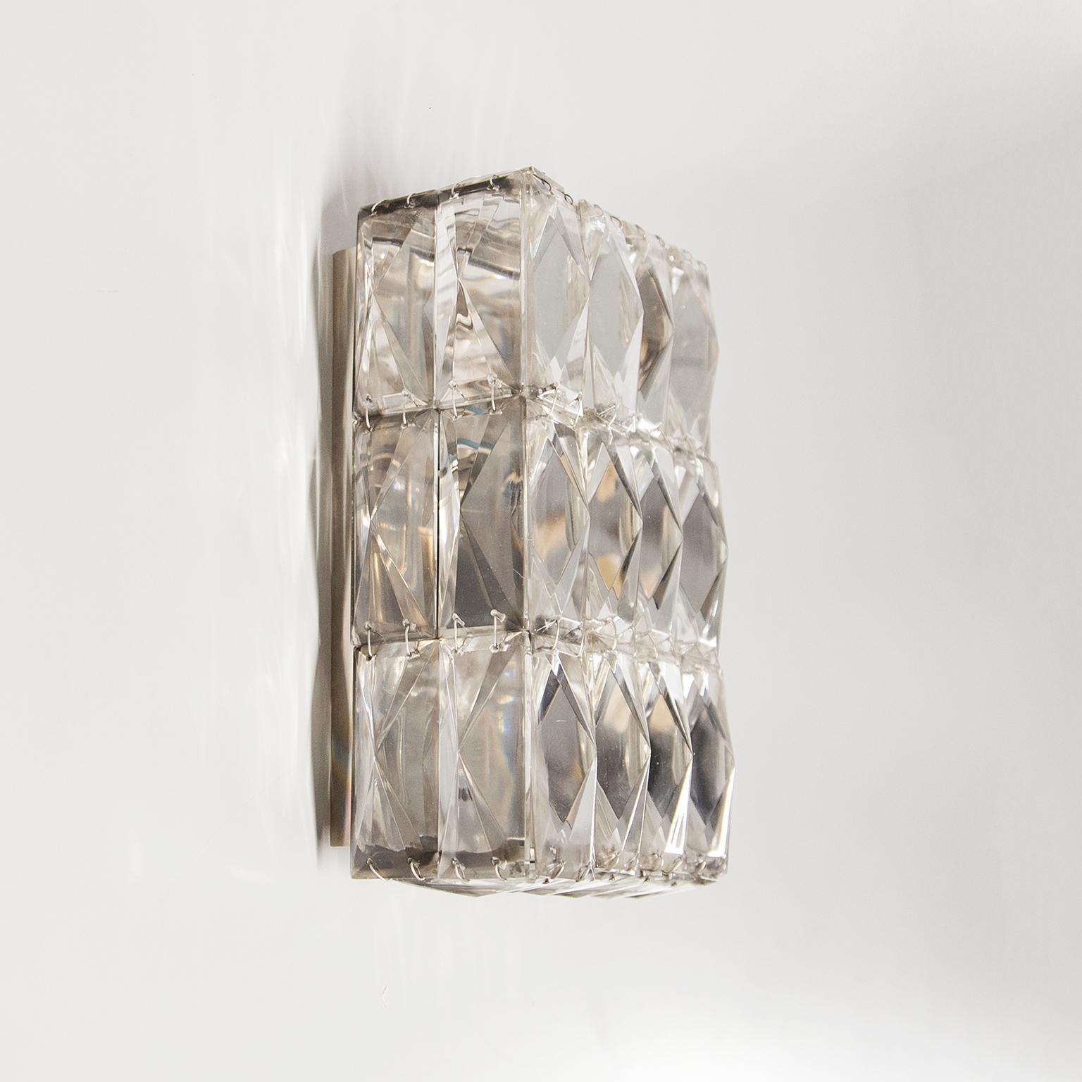 Pair of faceted crystal glass nickel-plated wall light or sconces, manufactured by Bakalowits Austria, circa 1950s, documented in the Bakalowits sales catalogue. The high quality and handmade light has a nickel-plated metal base with two E 14