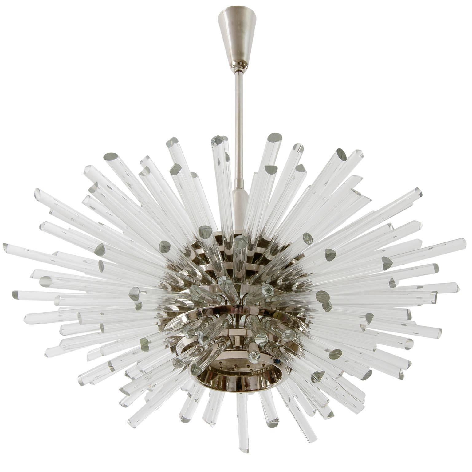 A fantastic Sputnik chandelier by Bakalowits & Söhne, Vienna, Austria, manufactured in midcentury, circa 1970 (late 1960s or early 1970s). 
The fixture consists of a layered multi-tier structure made of nickel-plated brass rings and glass rods with