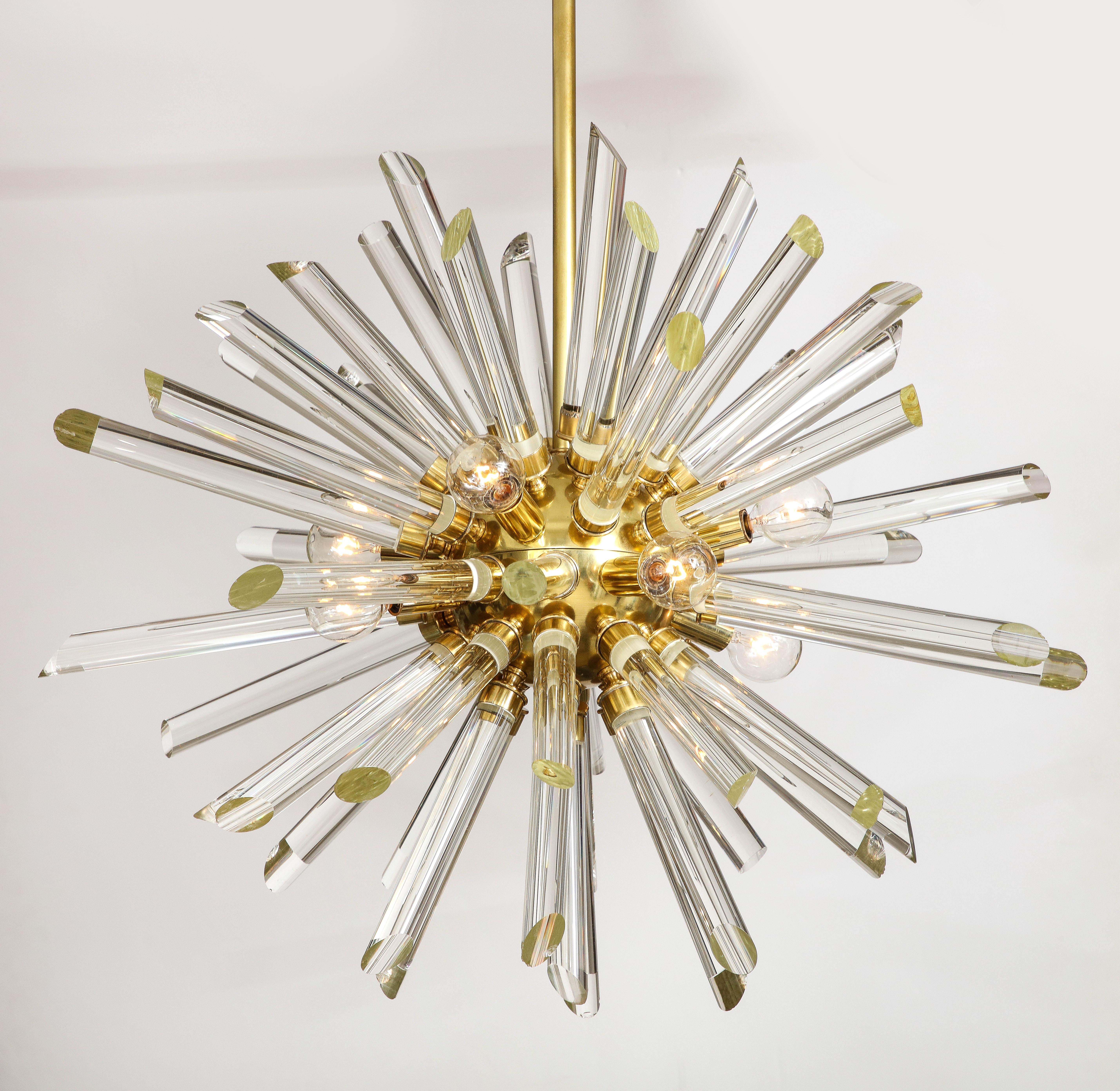 Spectacular eye catching crystal rod sputnik chandelier featuring a hand rubbed brushed brass frame and canopy. Currently 2 available. 6 sockets using candelabra type bulbs up to 60W each.

Vintage crystal rods on new frame. Minor wear to some