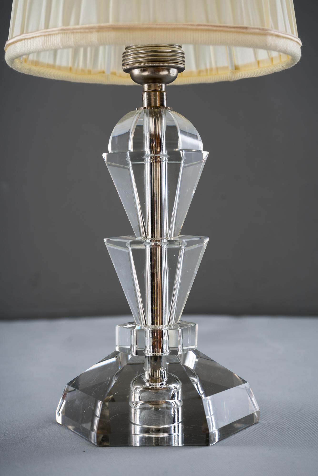 Bakalowits table lamp, circa 1950s
Glass, nickel-plated and fabric
Original condition
Fabric shade is replaced (new).