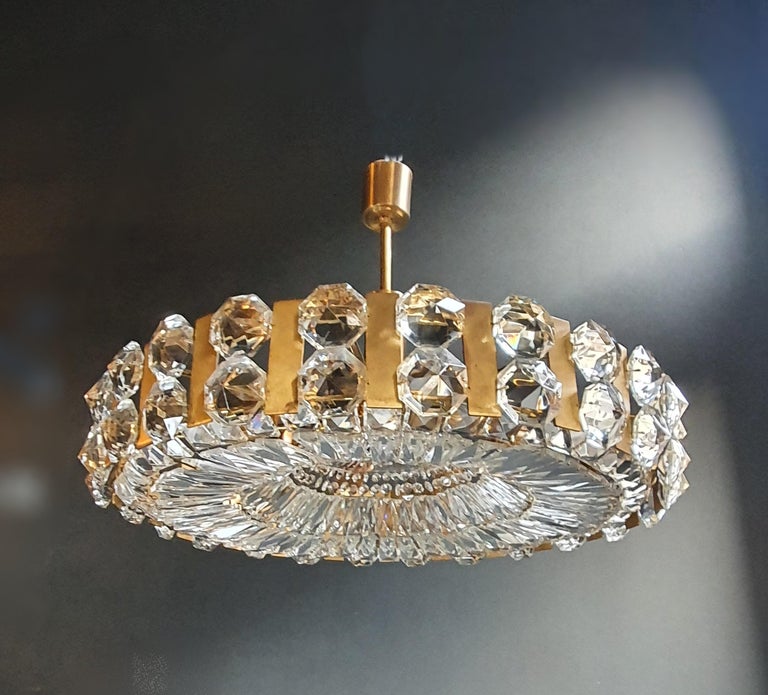 A masterpiece from the Bakalowits company from Austria, 1960s.

Measures: Total height 45 cm, height without chain 15 cm, diameter 69 cm. Weight (approximately): 15 kg.

Number of lights: 8-light bulb sockets: E27 material: Brass, cut glass,