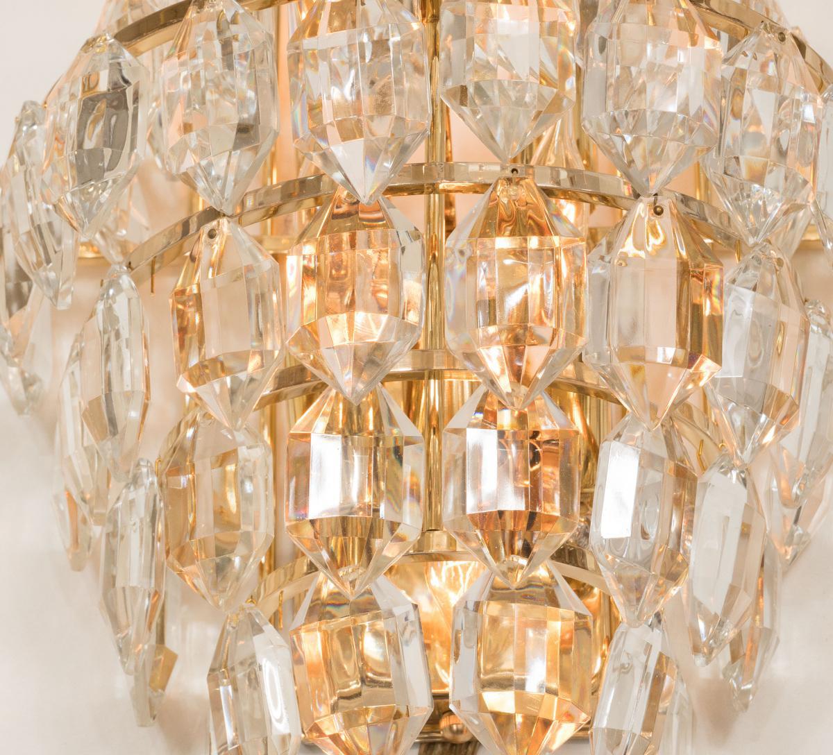 A stunning seven-tier wall sconce by Bakalowits & Sohne, Austria, manufactured in circa 1960-1969. The frame is made of gilt brass with lots of facetted crystal glass elements. 

High quality and in very good condition. Cleaned, well-wired and