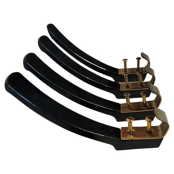 Wall hooks made of bakelite and brass, Vienna Austria around 1950.