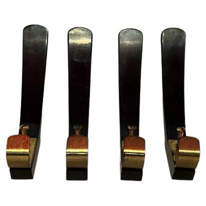 Metà XX secolo Bakelite and brass wall hooks, Austria, circa 1950 in vendita