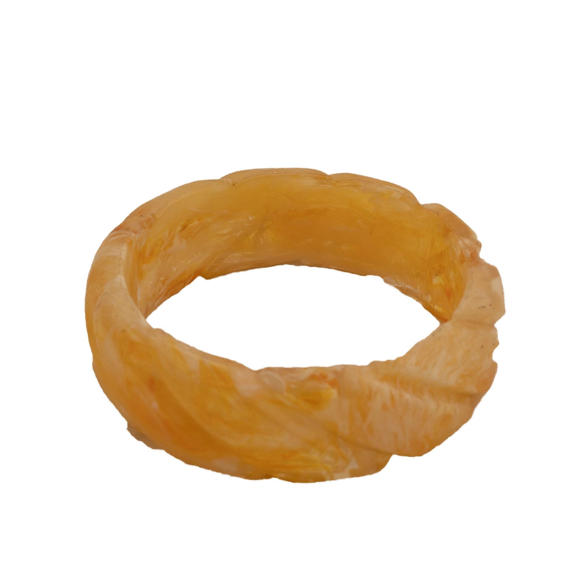 Bakelite bangle with carved diagonal braid shape, transparent and honey color. For Sale 1