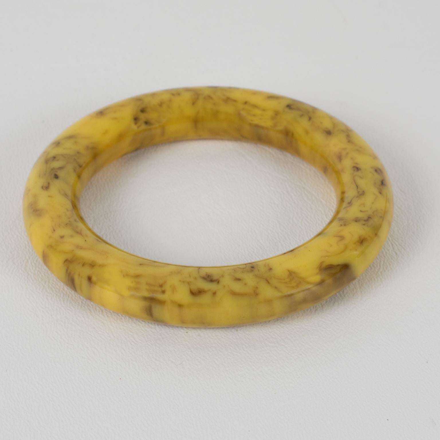 This lovely vanilla and chocolate marble Bakelite bracelet bangle features a chunky tube shape with an intense yellow vanilla custard tone and cloudy chocolate brown swirling. 
Measurements: Inside across is 2.50 in diameter (6.3 cm) - outside