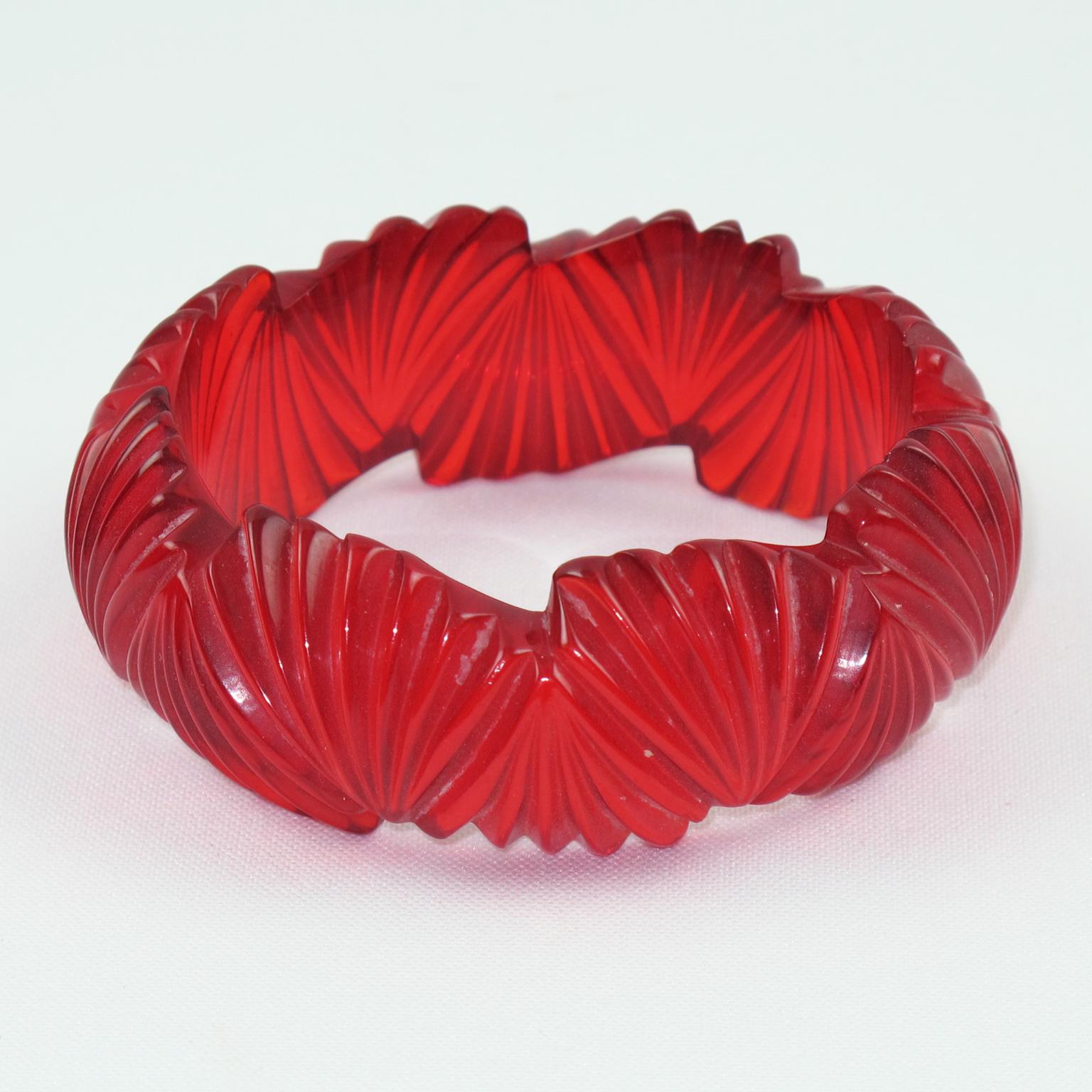 Gorgeous candy apple red Bakelite bracelet bangle. Chunky domed shape with fan deeply carved design all around. Beautiful Prystal quality Bakelite, with fully transparent candy apple red color and purple overtone on edges. 
This Prystal quality