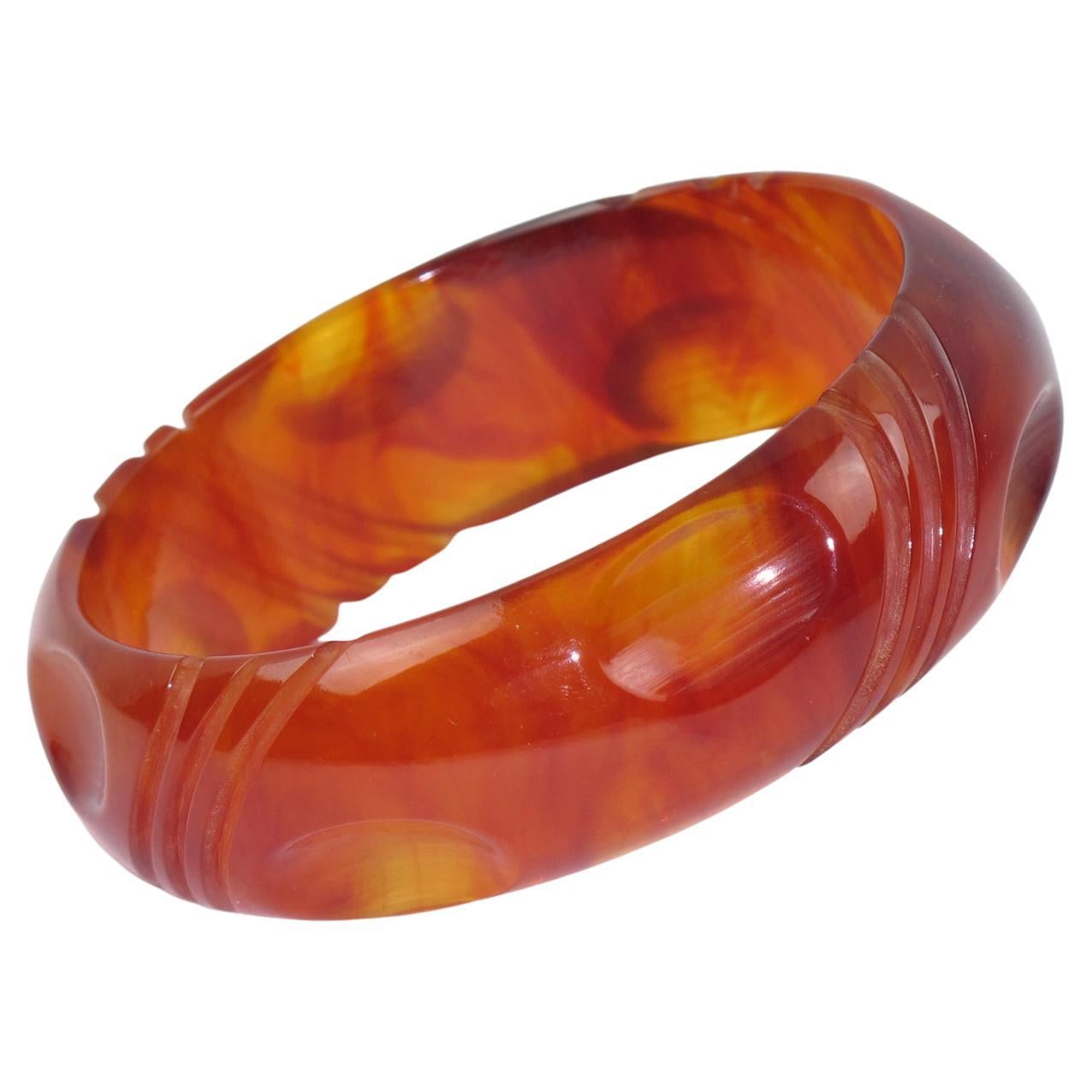Bakelite Carved Bracelet Bangle in Red Tea Amber Marble Color For Sale