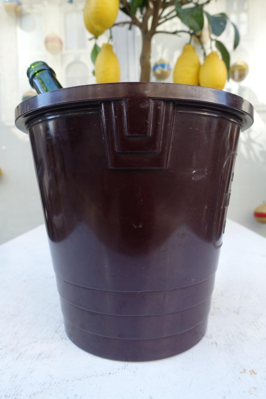 A rare and utterly stylish Art Deco champagne / wine ice bucket, from the prominent champagne house of Moët and Chandon. Produced back in the 1930s, in cast brown bakelite, with a faux bois look. All in all a sublime design, with the classic