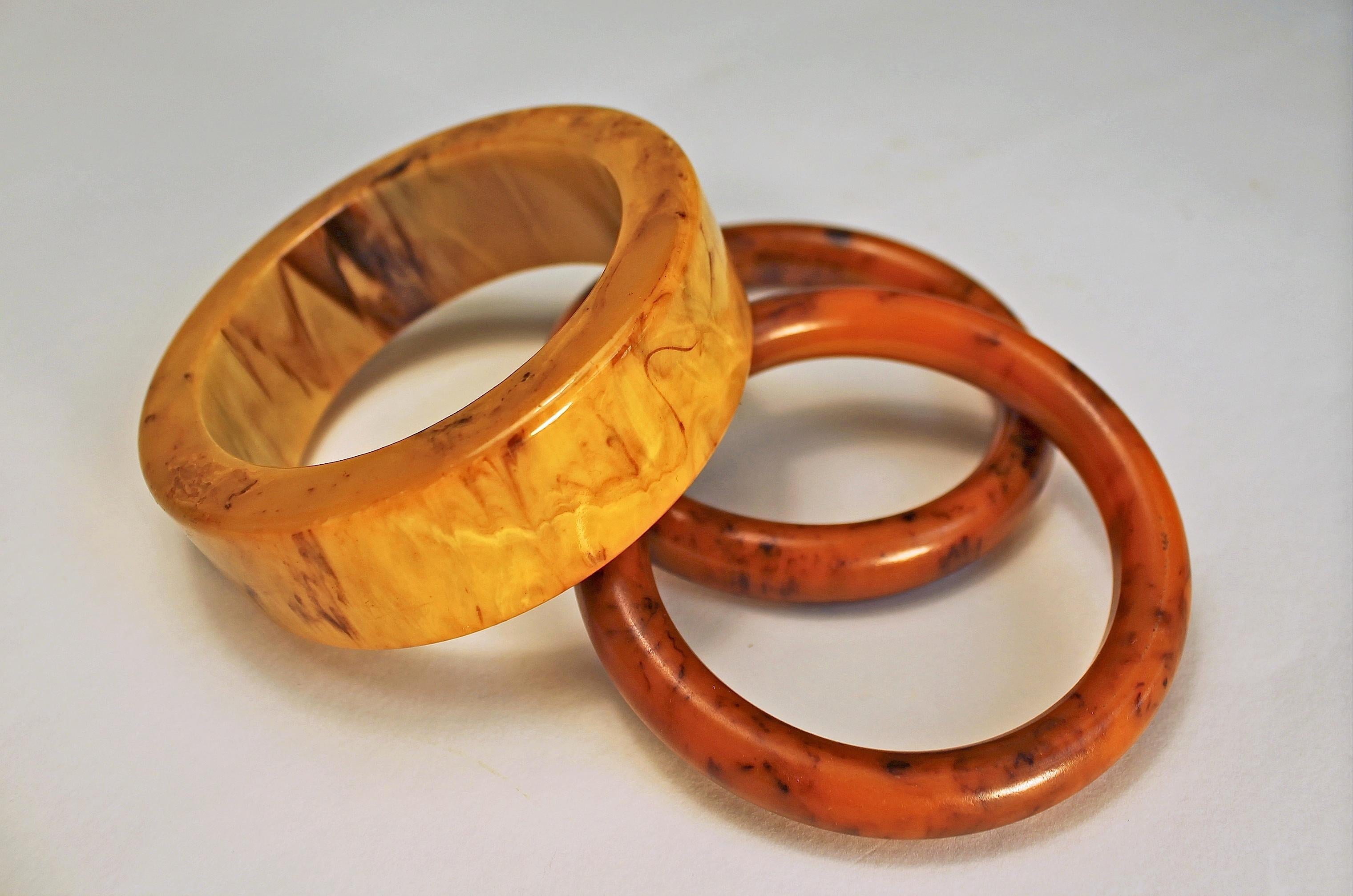 Fabulous trio of bakelite bangle cuffs in butterscotch and a warm caramel cinnabar color.  They look fabulous together or they can be worn separately.  You can't go wrong with this statement!!! Large cuff is 3.4