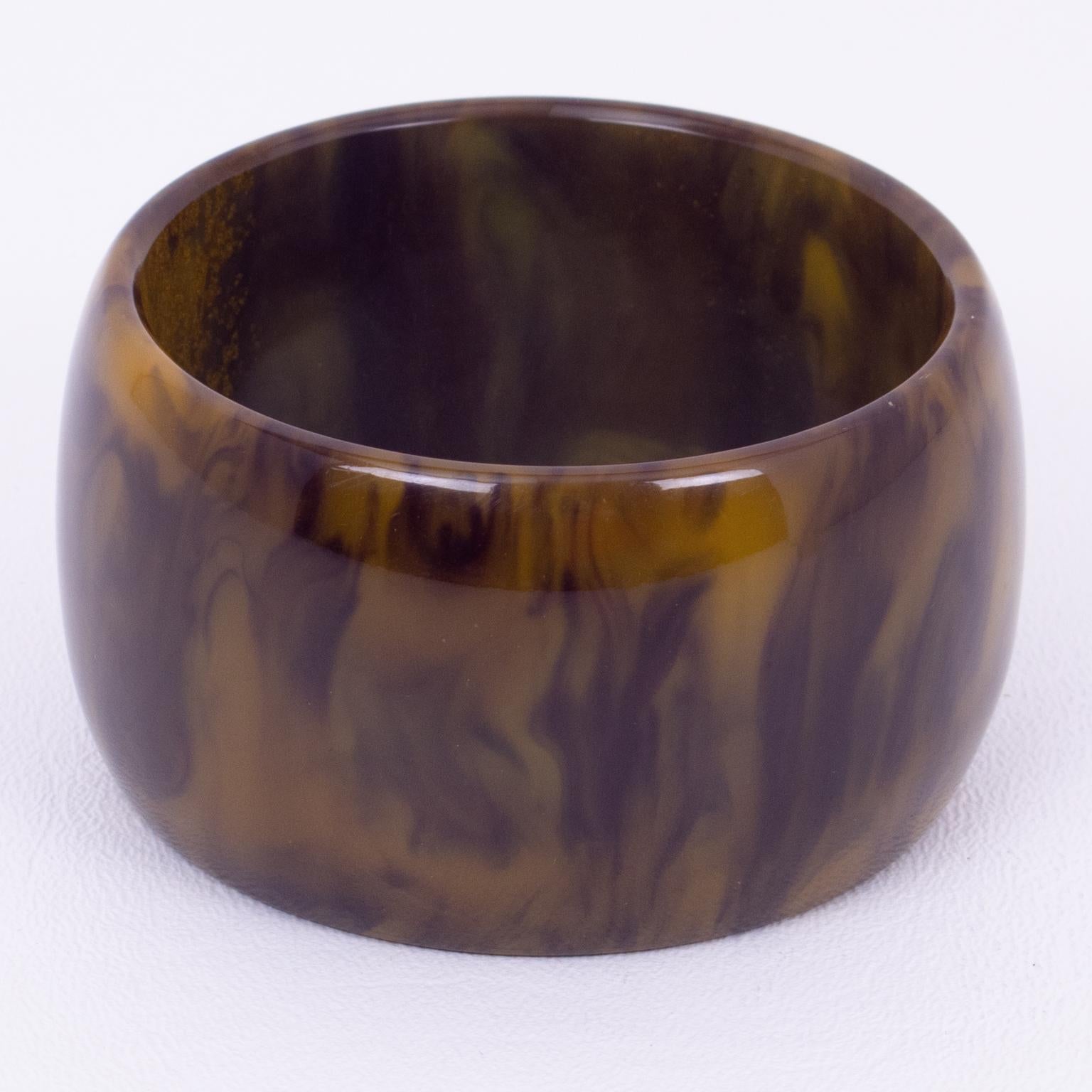This stunning purple-blue ink and custard marble Bakelite bracelet bangle has an XL wide domed shape and boasts an intense purple-blue marble tone with cloudy custard swirling, also called ink-spot color. 
Measurements: Inside across is 2.50 in