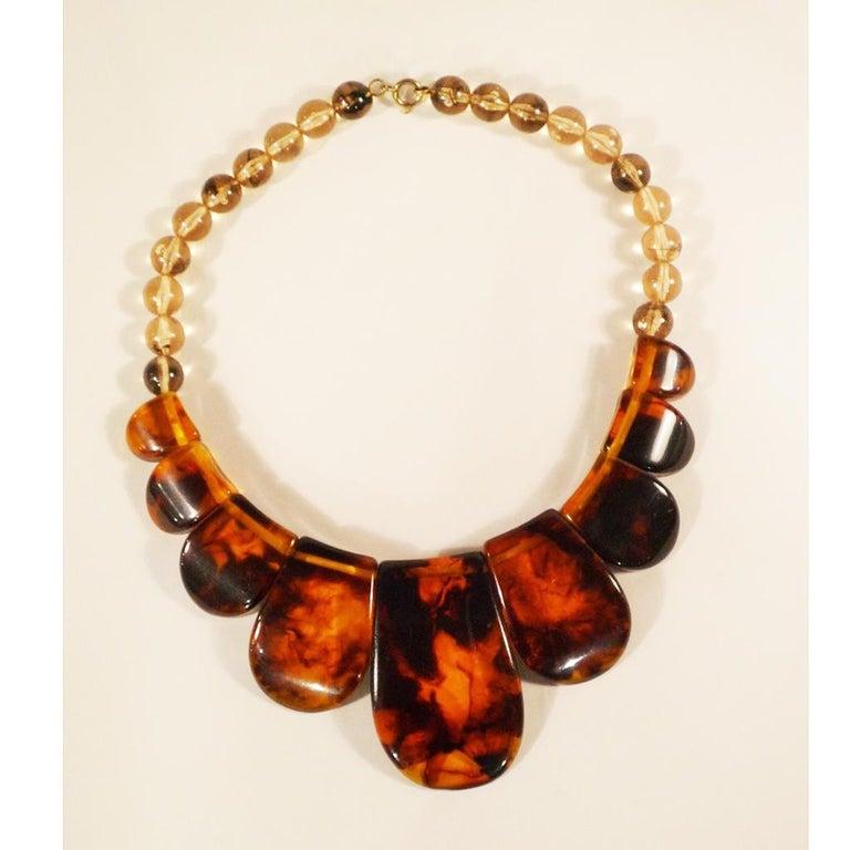 Bakelite necklace in horn optic, France, around 1920

Bakelite necklace, bakelite elements running on pearls, largest element 4 x 6 x 1 cm.
Width:
1 cm
Height:
42 cm
Depth:
1 cm
Color:
Brown
Material:
other plastics
Known defects:
minimal wear