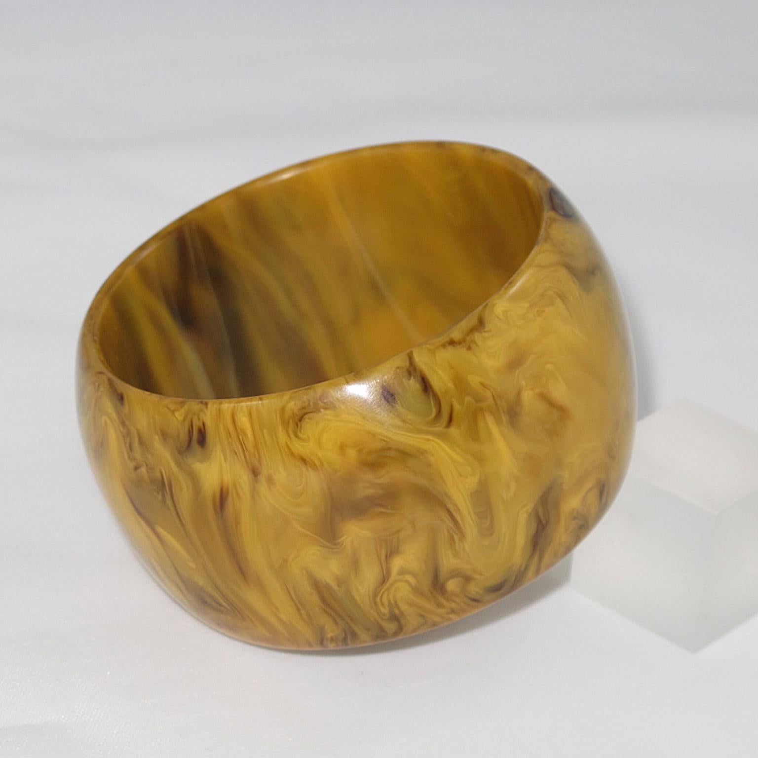 Handsome butterscotch and black marble Bakelite bracelet bangle. Oversized wide domed shape. Intense butterscotch color with black cloudy swirling also called Mississippi mud or swamp color. 
Measurements: Inside across is 2.63 in. diameter (6.7 cm)