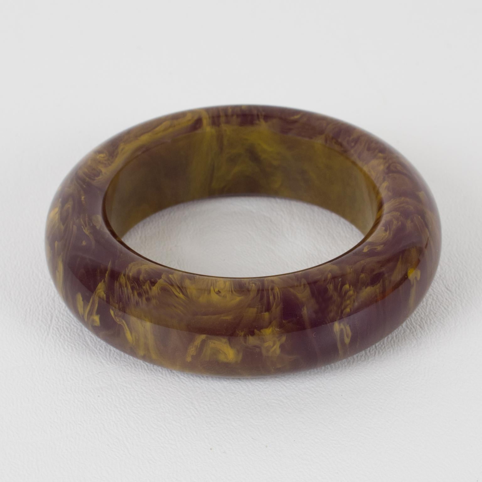 Spectacular purple stardust marble Bakelite bracelet bangle. Chunky domed shape with an extra thick wall. Intense purple marble tone with cloudy white swirling and gold flakes inclusions. 
Measurements: Inside across is 2.50 in. diameter (6.3 cm) -