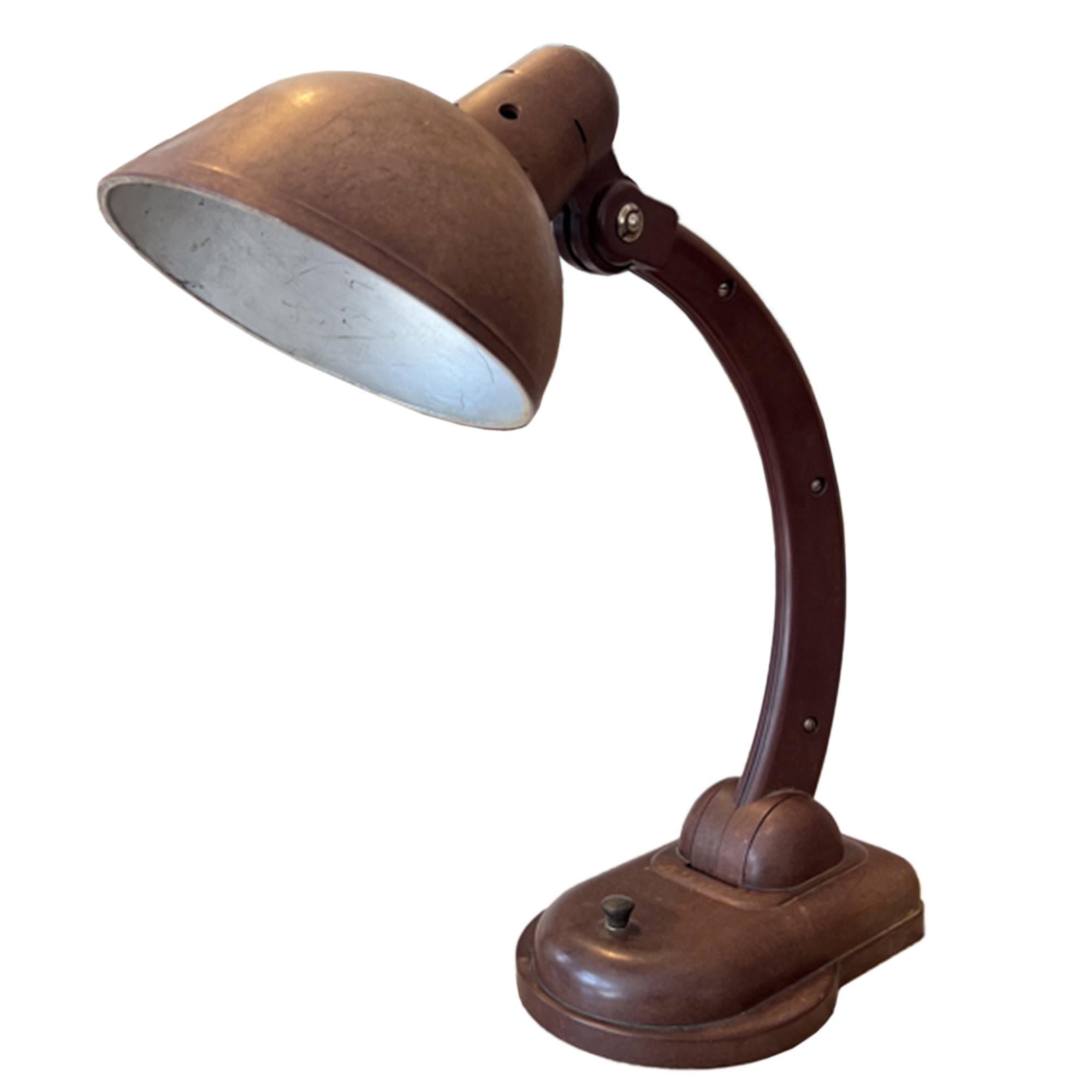 This desk lamp - the model 'Sigma' was made by Dell in the 1930s. 

With it's classic midcentury design and lovely colour, this is a super stylish desk lamp, or bedside light. Bakelite is renowned for it's versatility and strength. 

Rewired with
