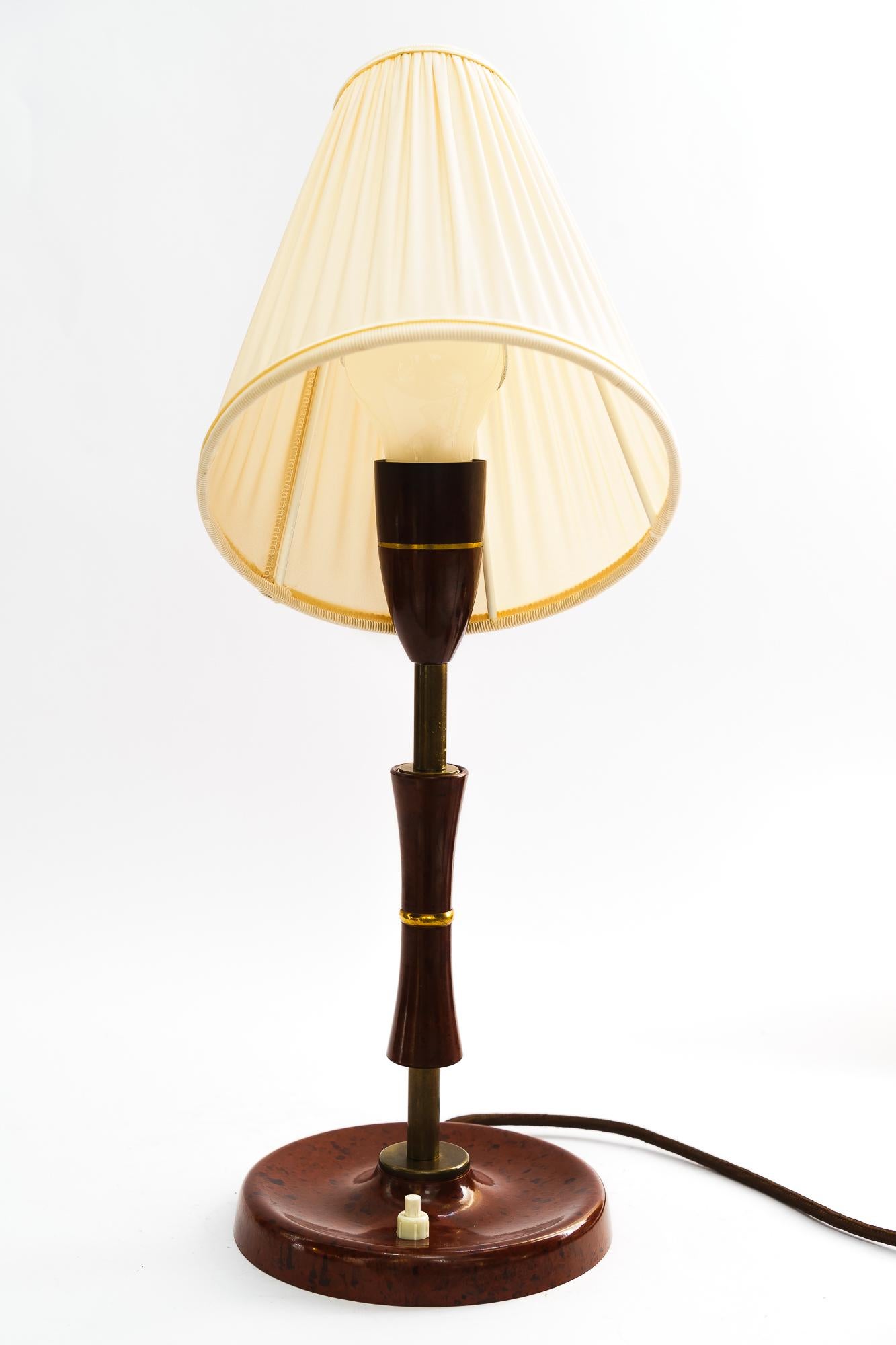 Bakelite Table Lamp Vienna with Fabric Shade Around 1930s
Original condition
The fabric shade is replaced ( new )