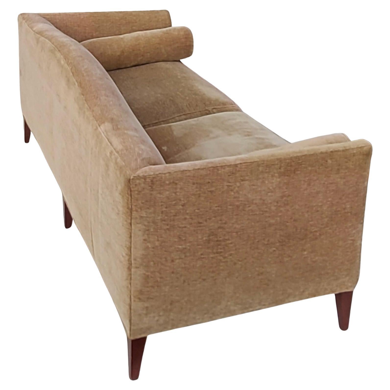 Please feel free to reach out for efficient shipping quote to your zip.
Baker archetype camelback sofa with a butter knife arm and symmetric bolsters. Loose seat. Square tapered maple wood legs. Model #2386-80, labelled. Retails $16,230