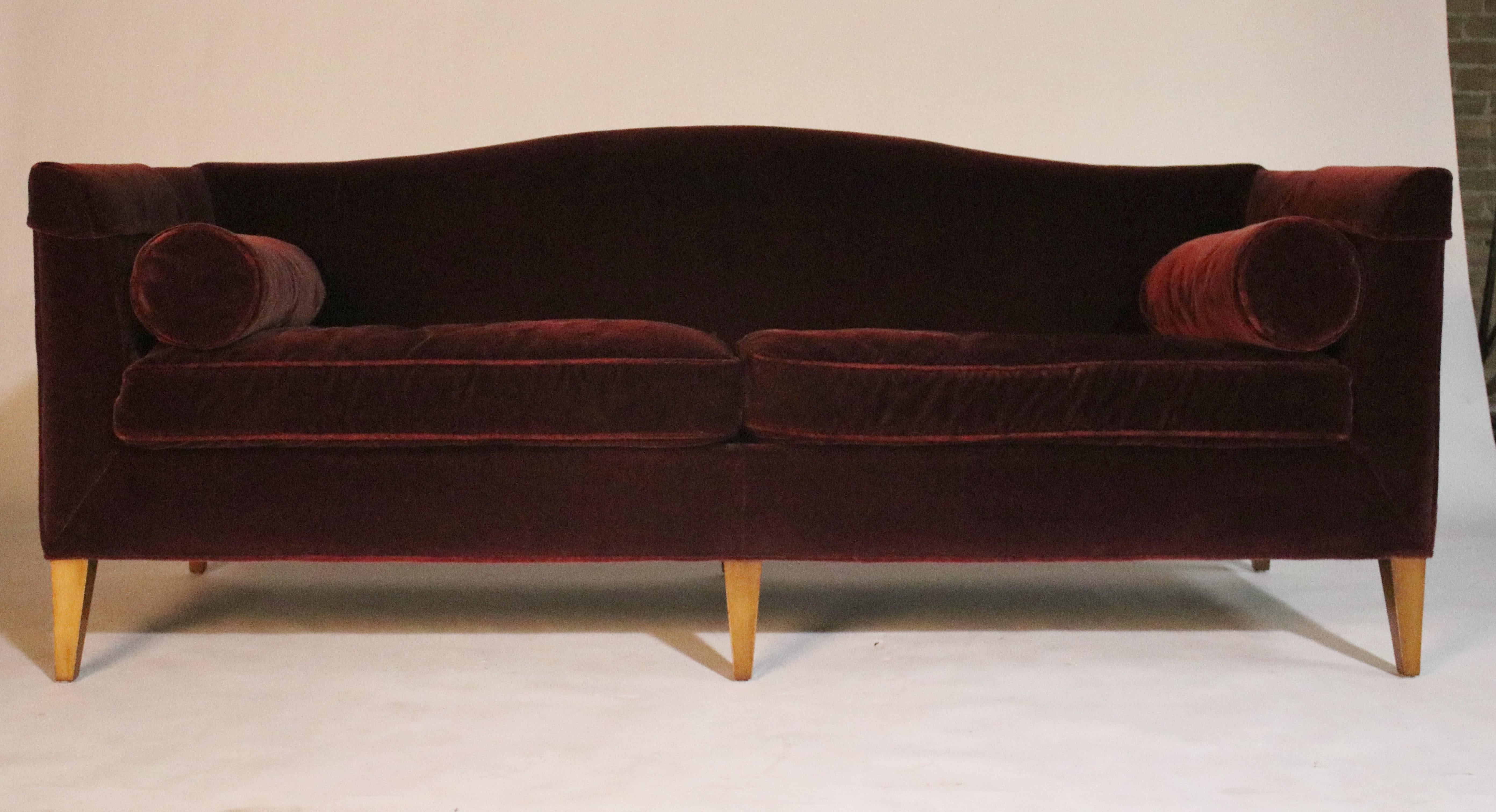 Baker archetype camelback sofa in deep red merlot mohair with a butter knife arm and symmetric bolsters. Loose seat. Square tapered maple wood legs. Model #2386-80, labelled. Retails $16,230.