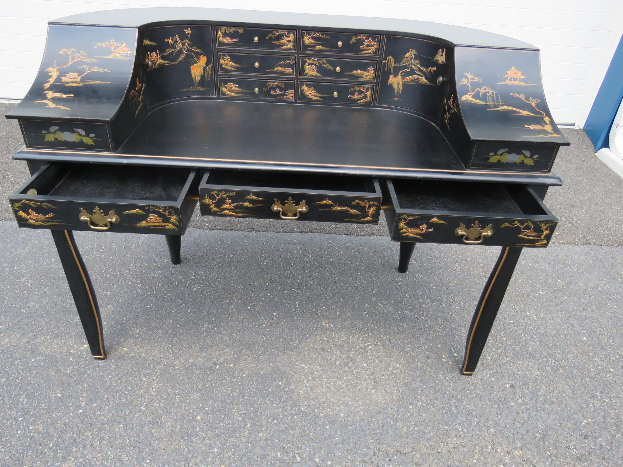 Baker Furniture Co Asian inspired paint decorated Carlton House desk with multiple doors and drawers.