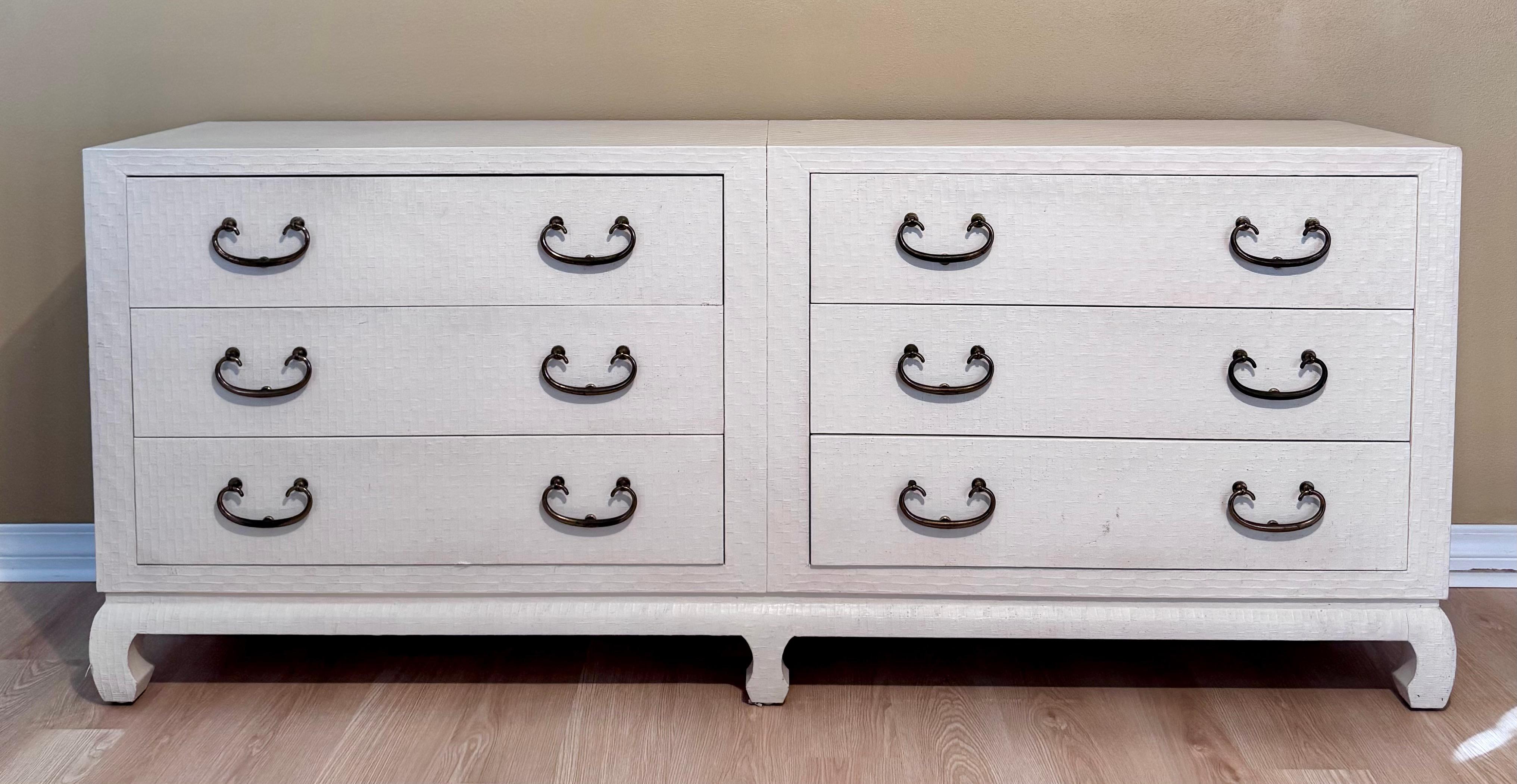 Chic, rare find-- A fabulous Hollywood Regency style six drawer grass cloth raffia cream lacquer mid century chest by Baker Furniture. Features a smooth, glossy lacquered grass cloth and a sleek, rectangular silhouette-epitomizing the sophisticated