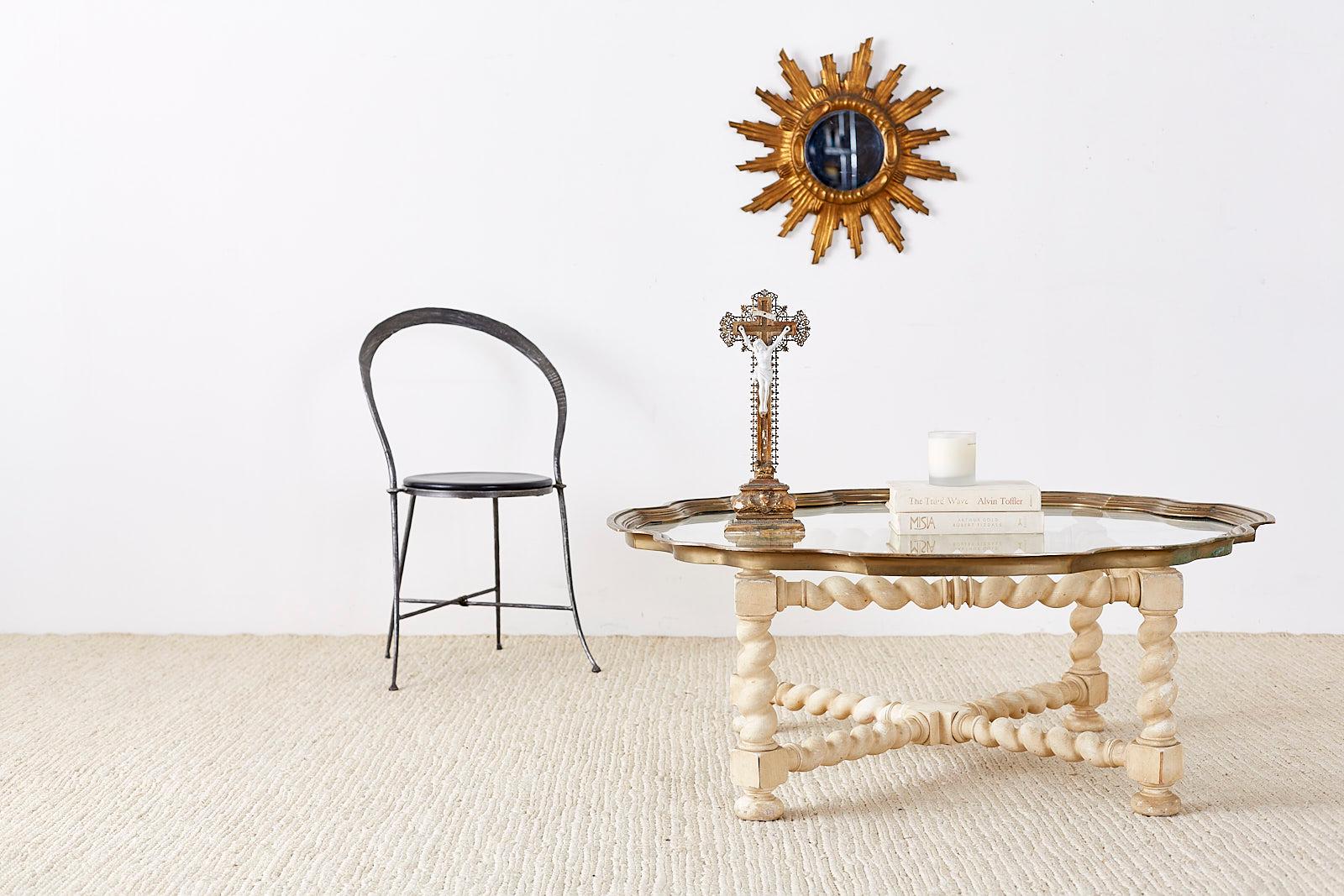 Hollywood Regency coffee table or cocktail table from Baker Furniture's Collector Edition. Features a white-washed oak barley twist base frame. The large brass tray top features a pie crust or scalloped edge inset with a pane of glass. The base is