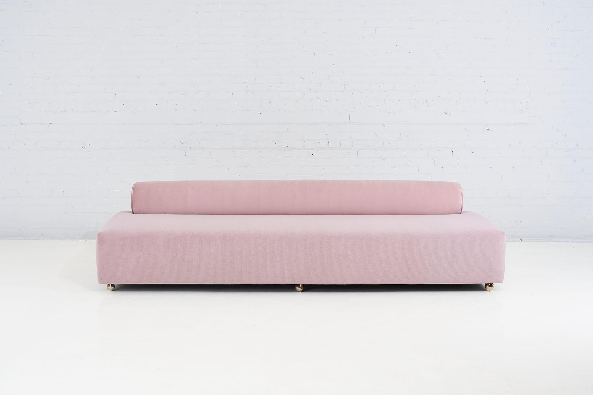Baker bolster back sofa, 1958. Completely restored and reupholstered with a textured pink mohair seat and a darker tone pink velvet bolster.
