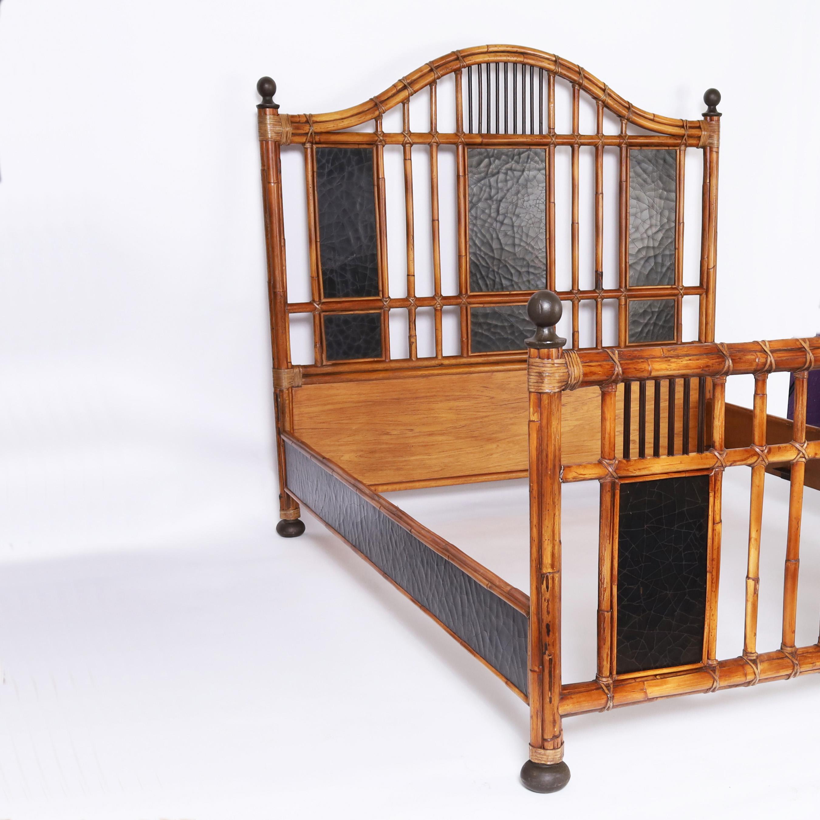 British Colonial style queen size bed frame crafted in bamboo and bent bamboo with reed wrapped joints, lacquered panels with a crackle glaze, and bronze finials and feet. Signed Milling Road for Baker. 

Inside dimensions- W: 62 D: 80
