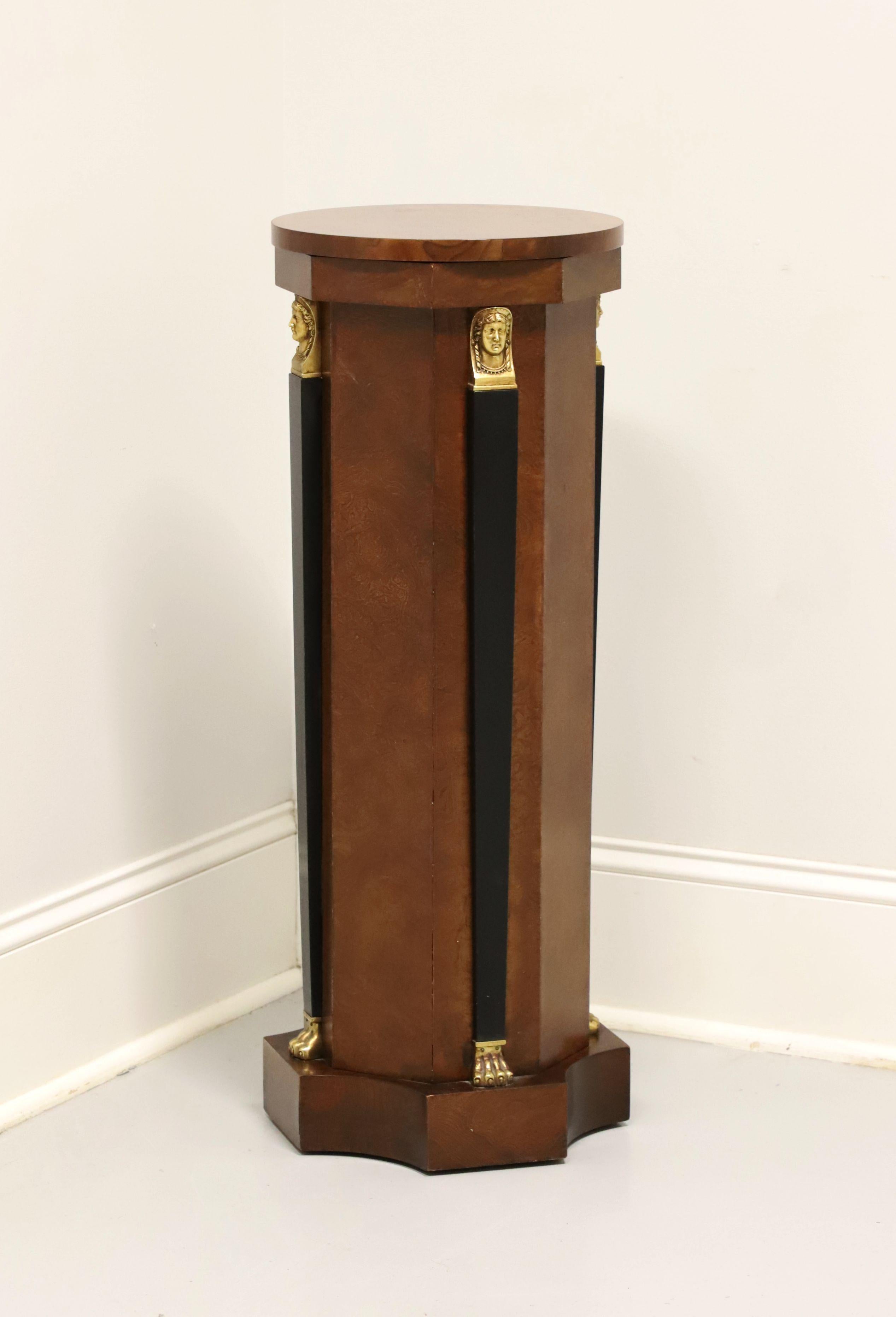 A Neoclassical style pedestal display column / plant stand by Baker Furniture. Walnut, burl walnut round top, multi-sided pedestal, black lacquer accent columns with gold painted classical faces & paw feet, and a solid base. Features a removable