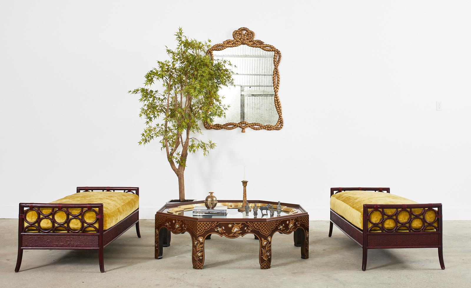 Stunning Mid-Century Modern period octagonal lacquered cocktail table featuring a large patinated brass tray top. Crafted by Baker Furniture in the Asian chinoiserie taste with a galleried edge on the top of the table and a removable brass tray with