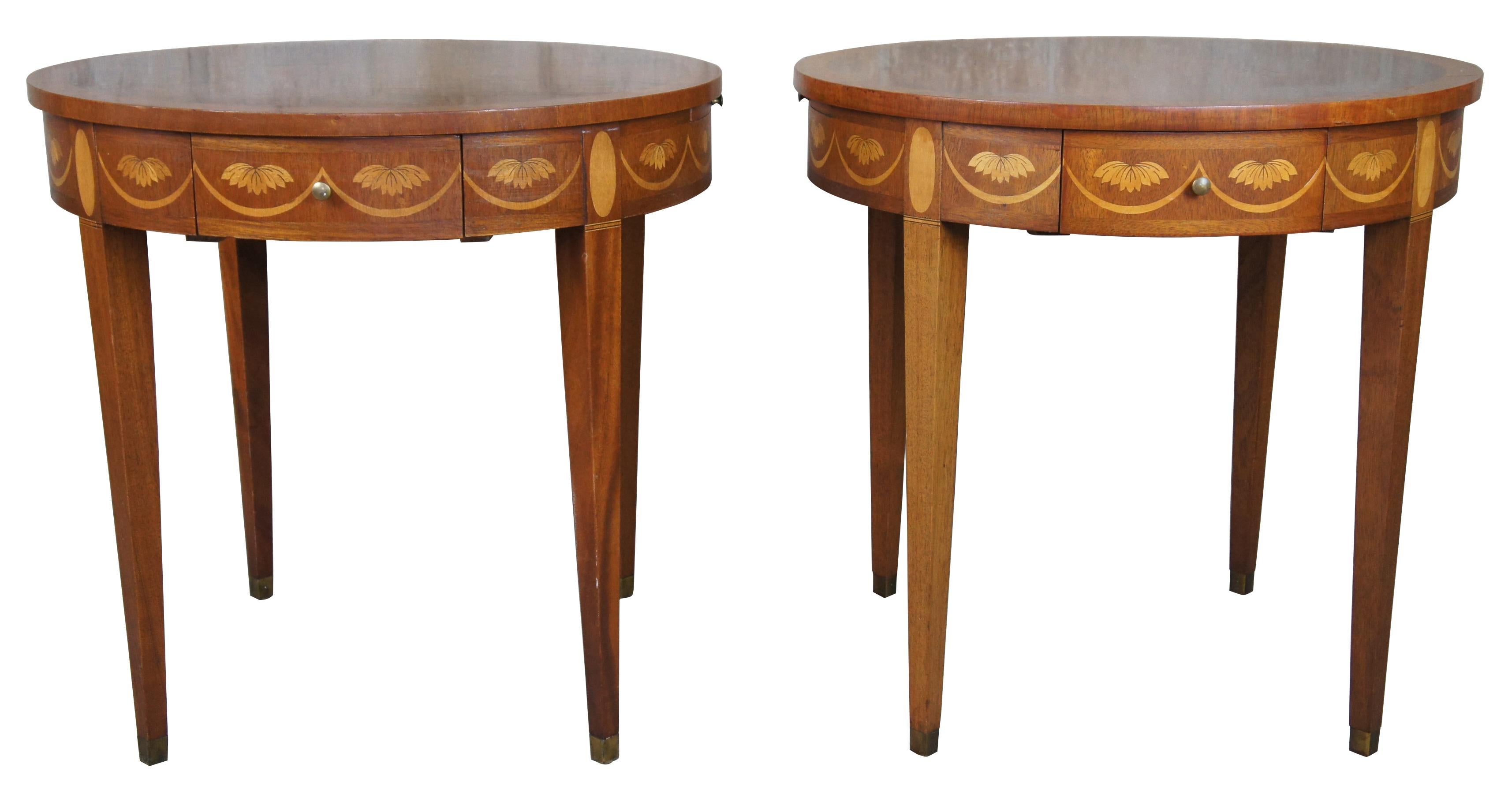Baker Chippendale round inlaid side end table with pullout tray flame mahogany burl

A pair of flame mahogany round side tables by Baker Furniture, attributed to the Historic Charleston collection. The round tops with satinwood banding with side