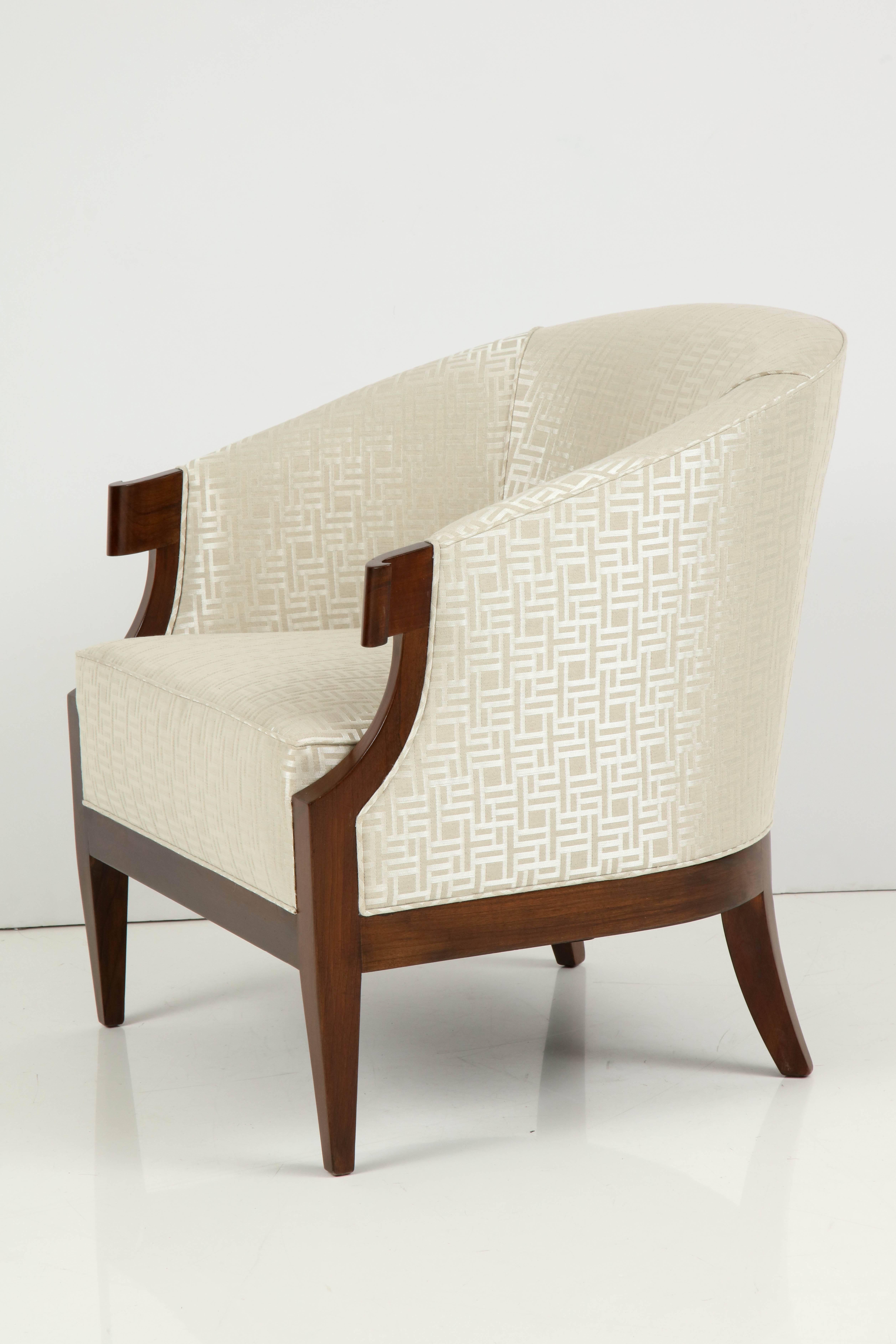 Pair of midcentury, Continental collection club chairs designed by Winsor White/ William Millington for Baker Furniture. Chairs feature Walnut frames and have been upholstered in a heavy graphic silk/cotton/linen upholstery from ROMO. Mint restored