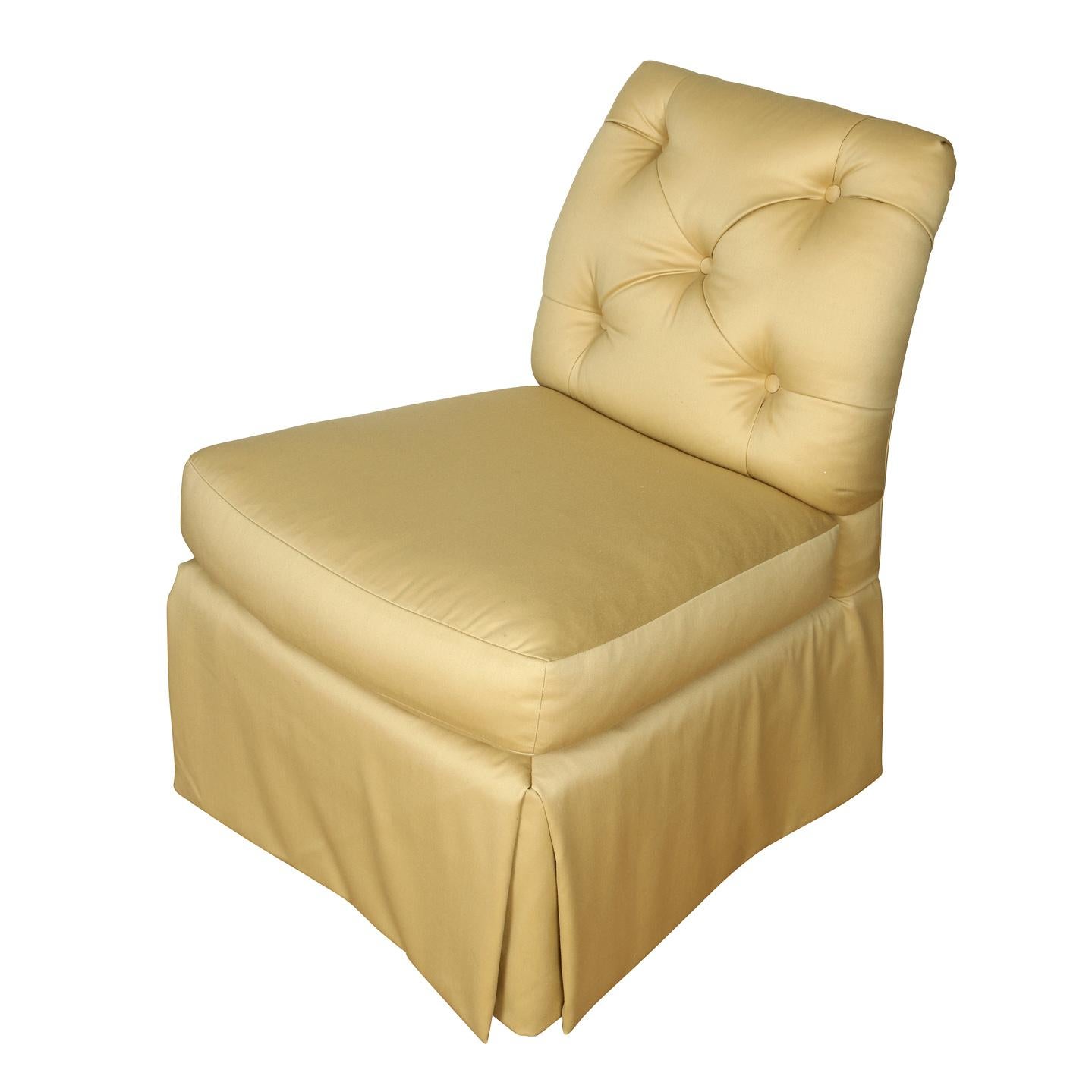 Baker cream upholstered slipper chair with tufted back and tailored, skirted bottom.