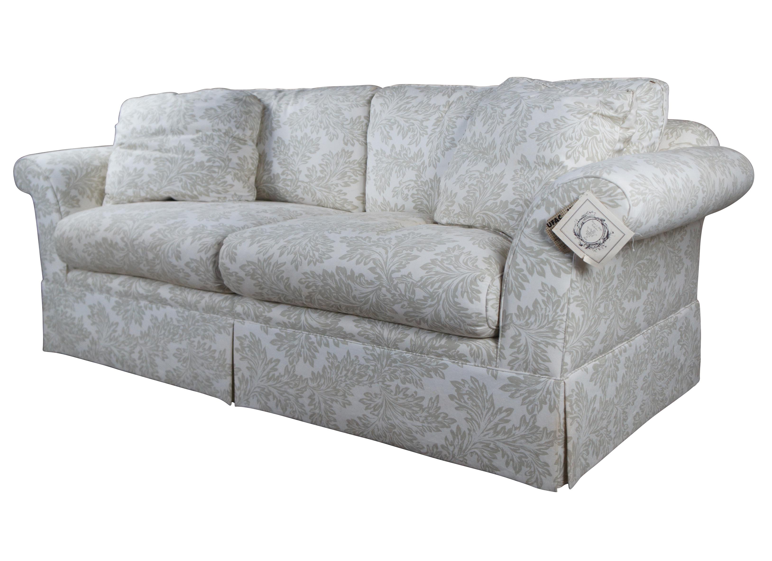 Vintage Baker Crown & Tulip Collection Sofa, circa last quarter 20th century. Features a rectangular form with rolled arms, down filled cushions and throw pillows. #6819-88C. Upholstered in an off-white fabric with olive green / acanthus design.