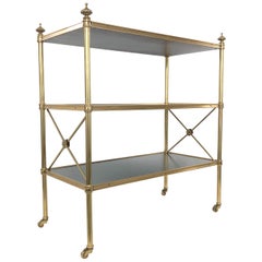 Baker Directoire Brass and Leather Rolling Shelves